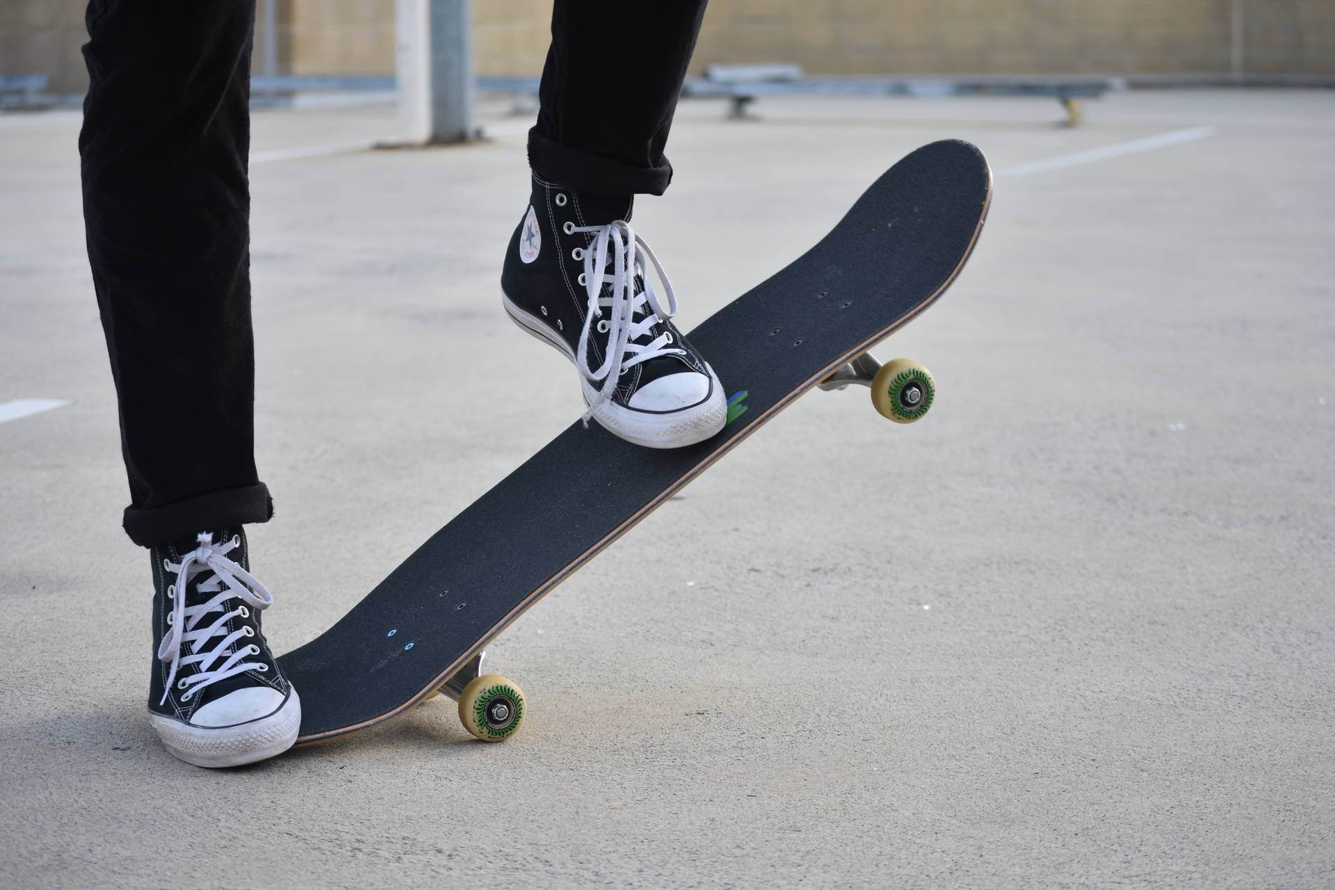 Skateboard with Colorful Chuck Taylors. Wallpaper