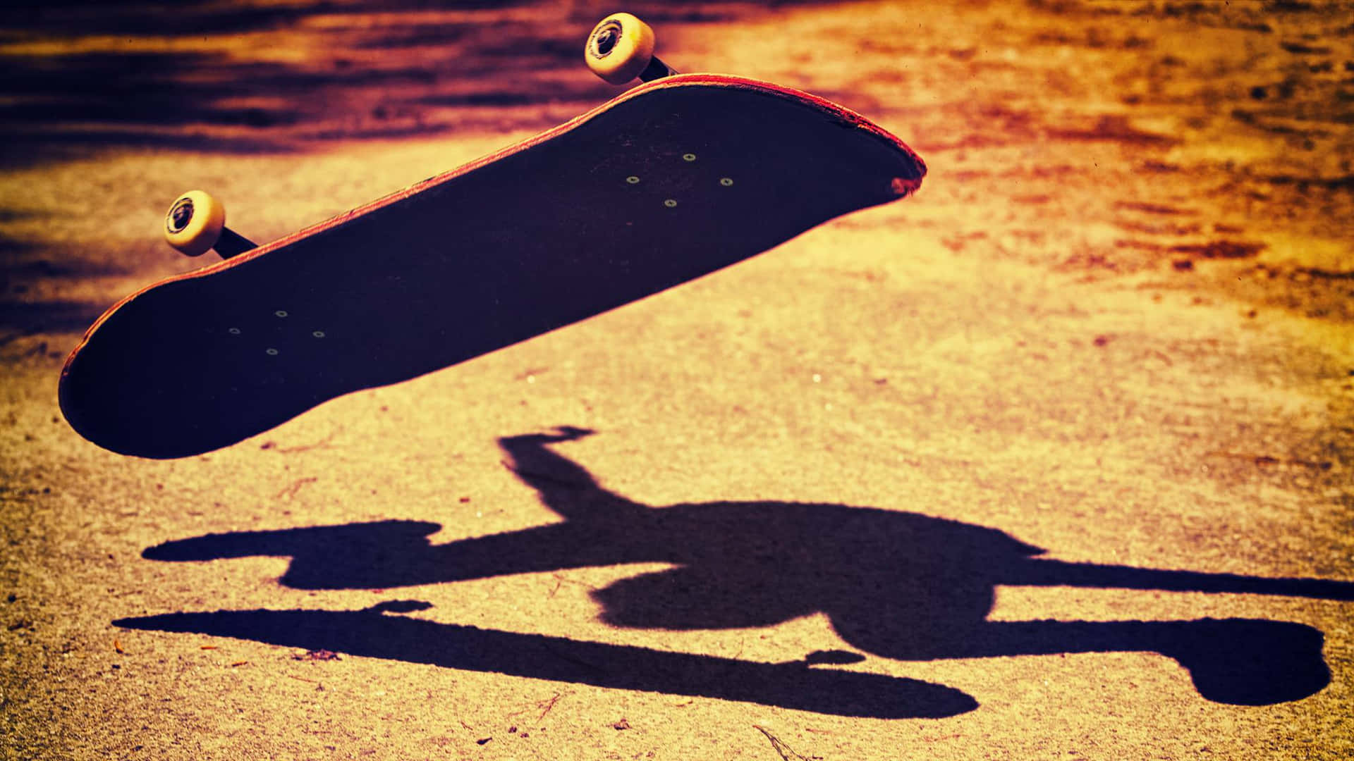 En person, der udfører et skateboard trick af en rampe Wallpaper