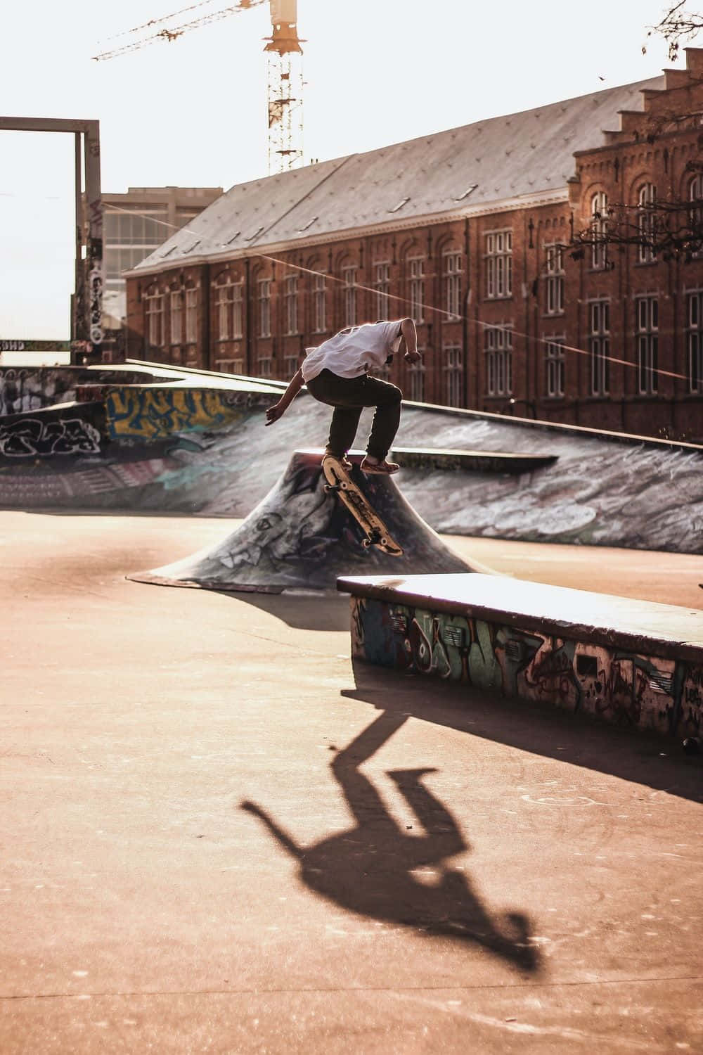 A Skateboarder Doing A Trick On A Ramp