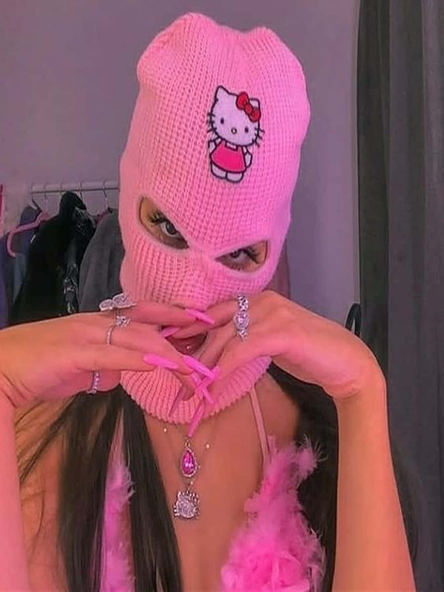 Hola,chica Con Máscara De Esquí De Hello Kitty En Rosa. Fondo de pantalla