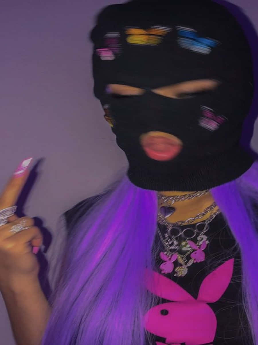 A Woman With Purple Hair Wearing A Black Mask Wallpaper