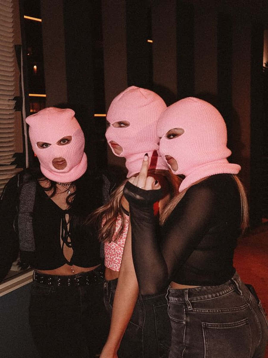 Three Pink Ski Mask Girl Models Wearing Black Wallpaper
