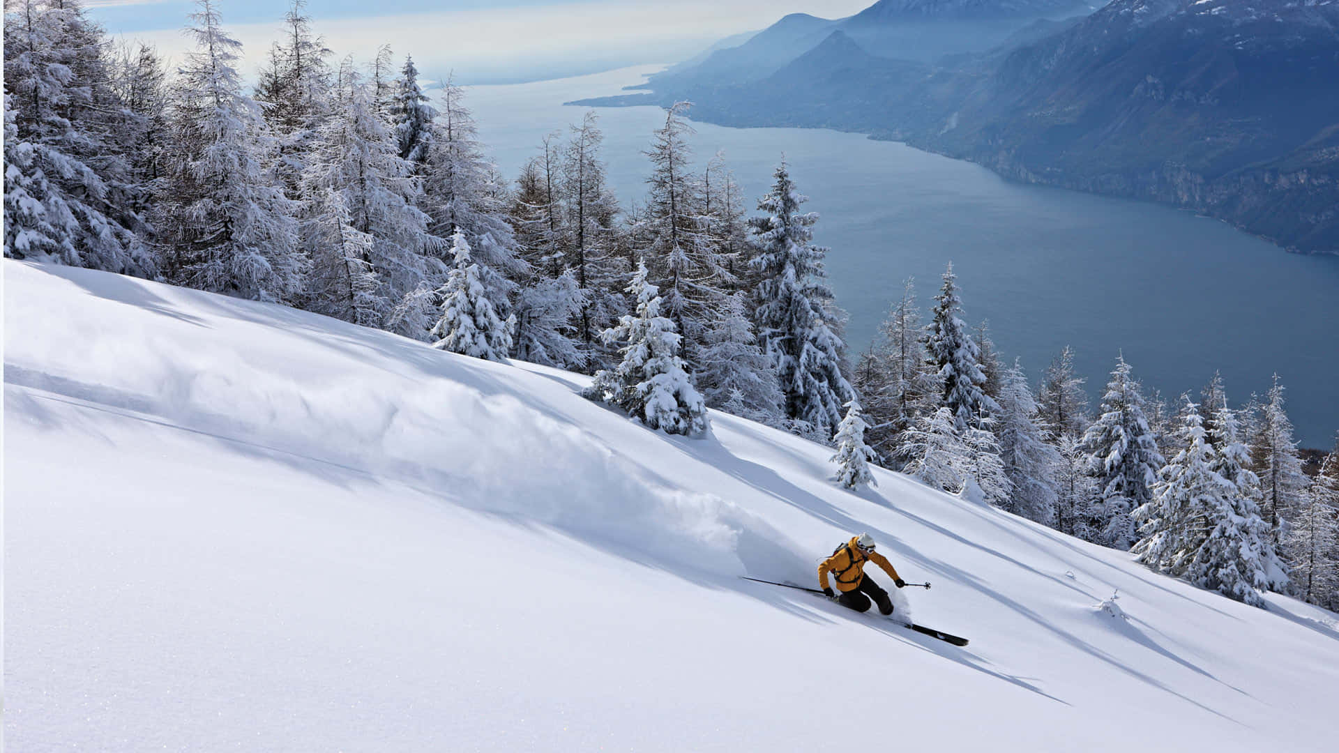 Conquer the winter with snow-capped mountains and ski trails. Wallpaper