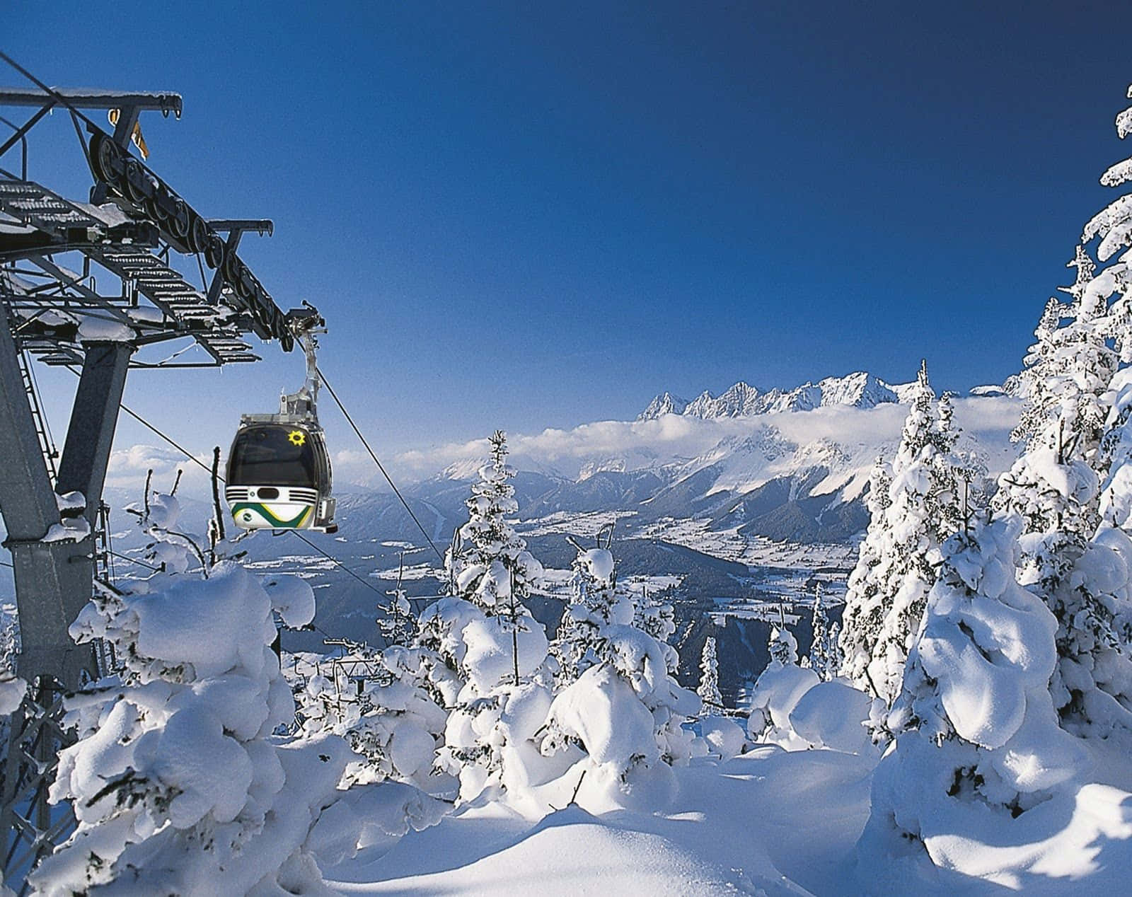 Conquer the slopes and embrace the stunning beauty of the ski mountain Wallpaper