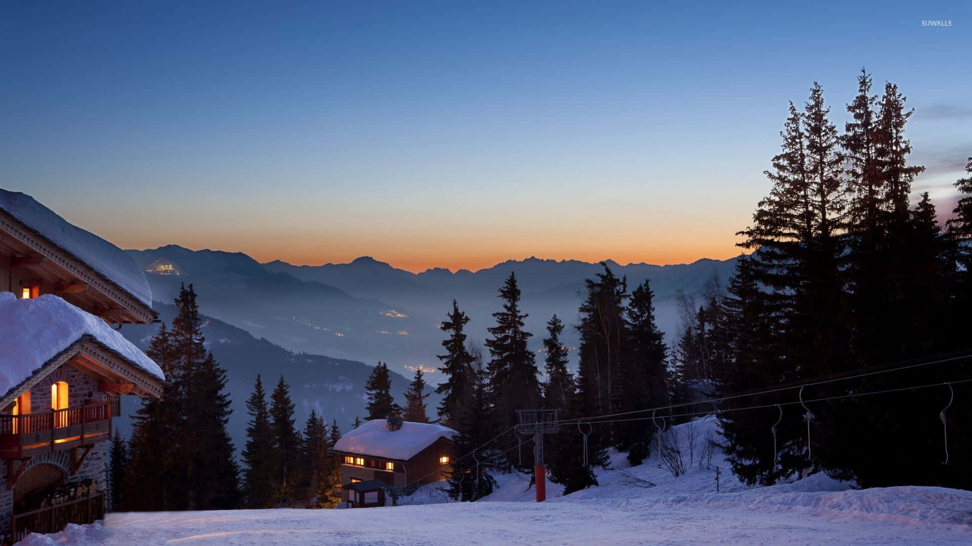 Ski Resort with Stunning Snowy Mountains Wallpaper