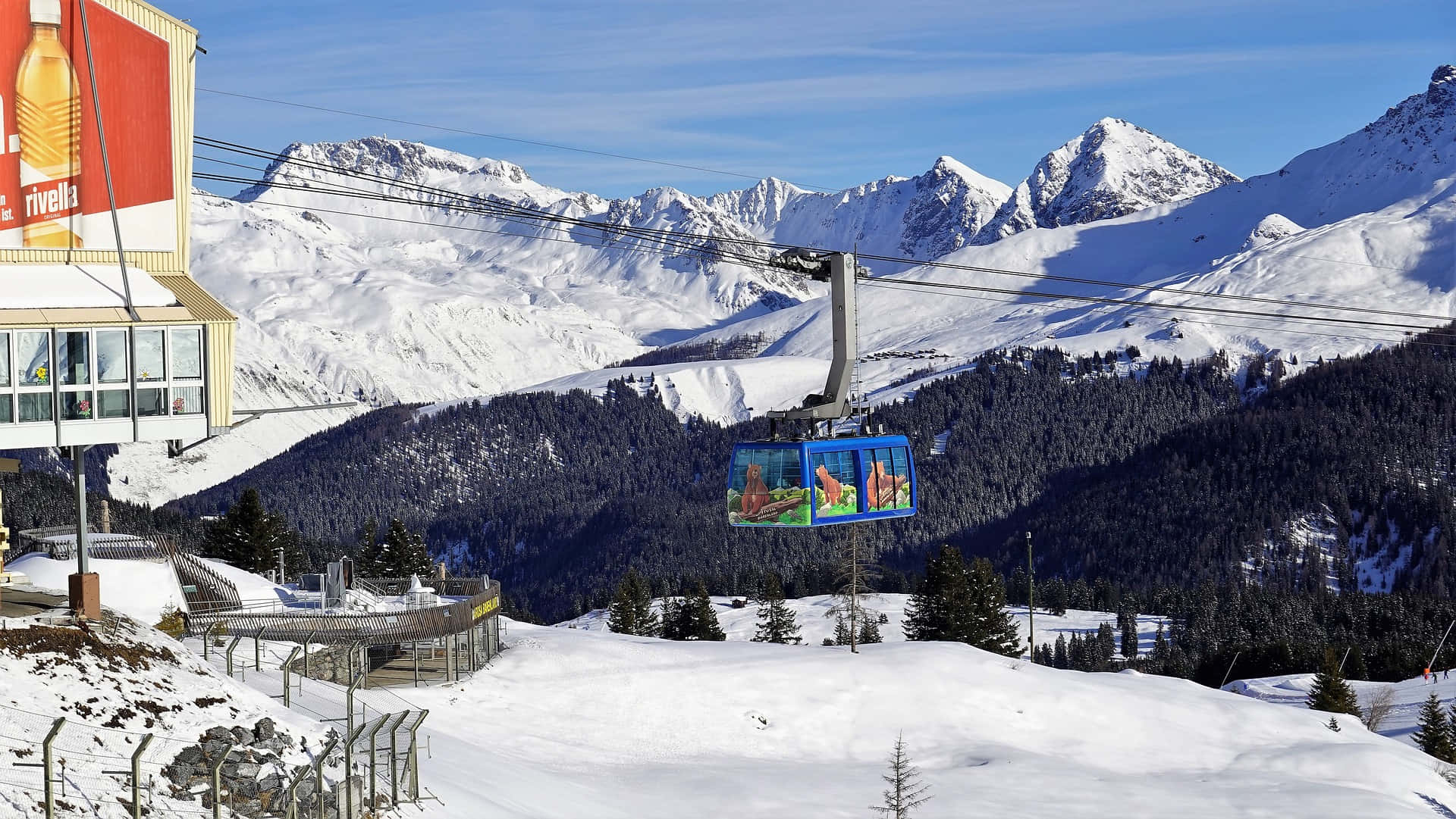 Majestic Ski Resort with Snowy Mountain Peaks Wallpaper