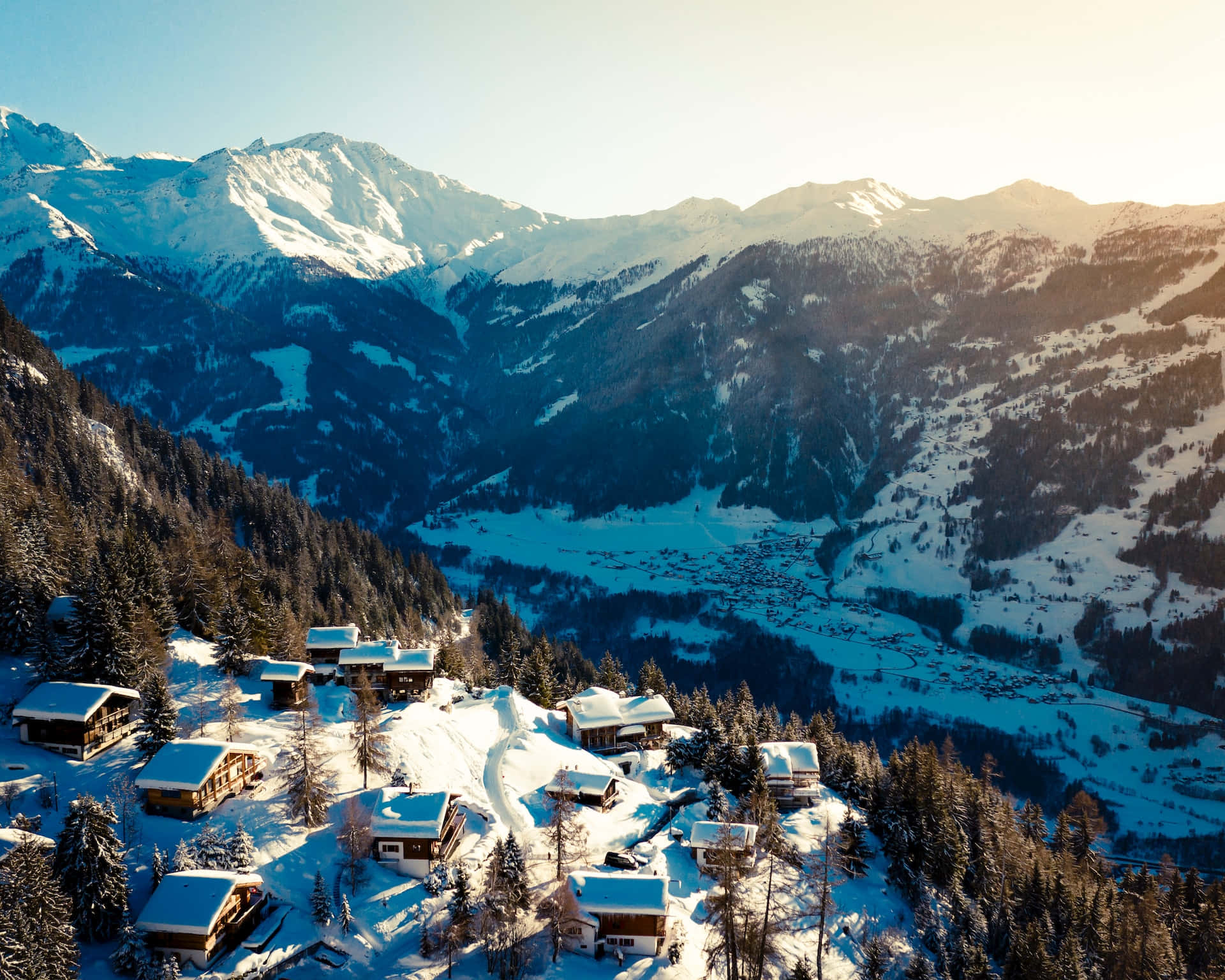 Breathtaking Snow-Covered Ski Resort during Winter Wallpaper