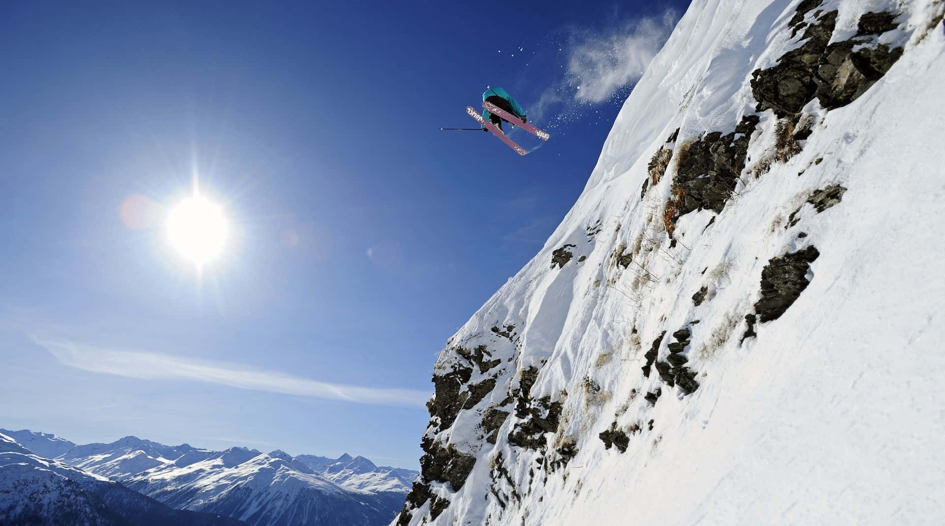 Skier gliding down a snowy mountain