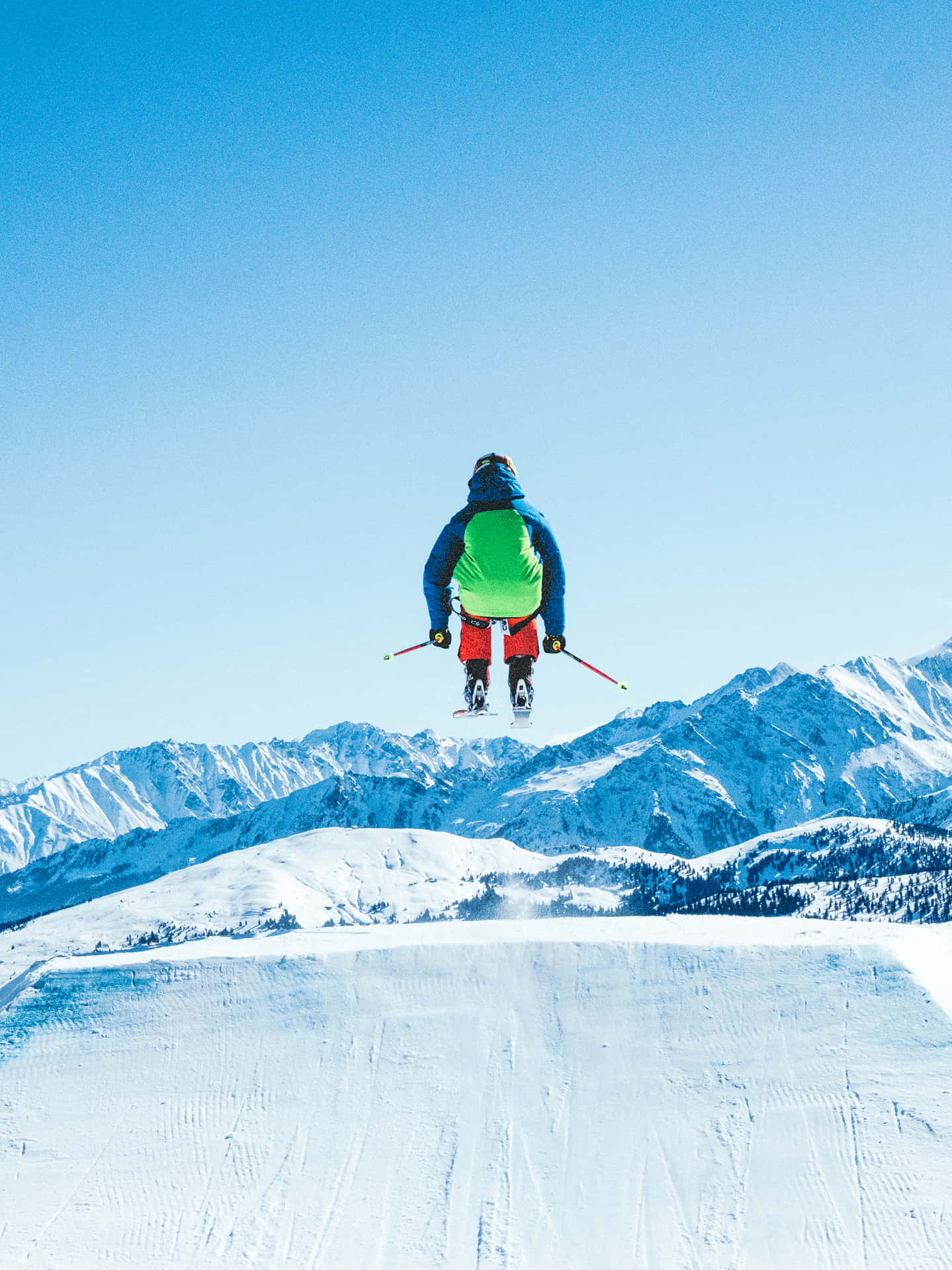 Professional skier gliding down snowy mountain slope