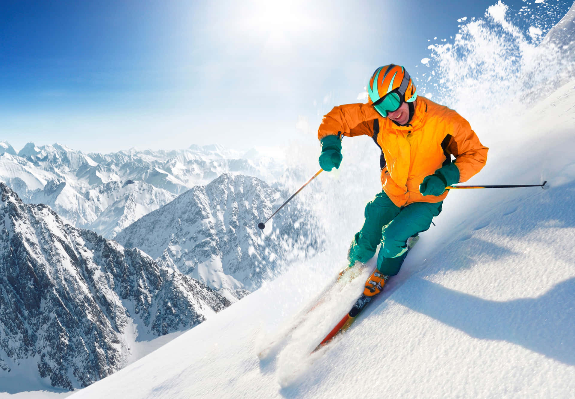 A Man Skiing Down A Mountain Wallpaper