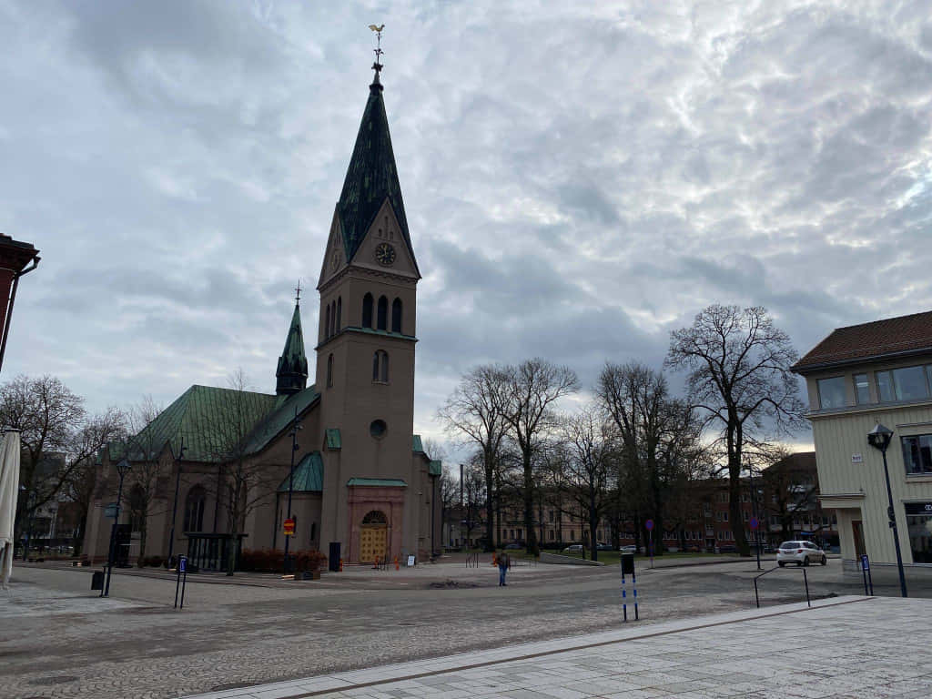 Skovde Cathedral Cloudy Sky Wallpaper