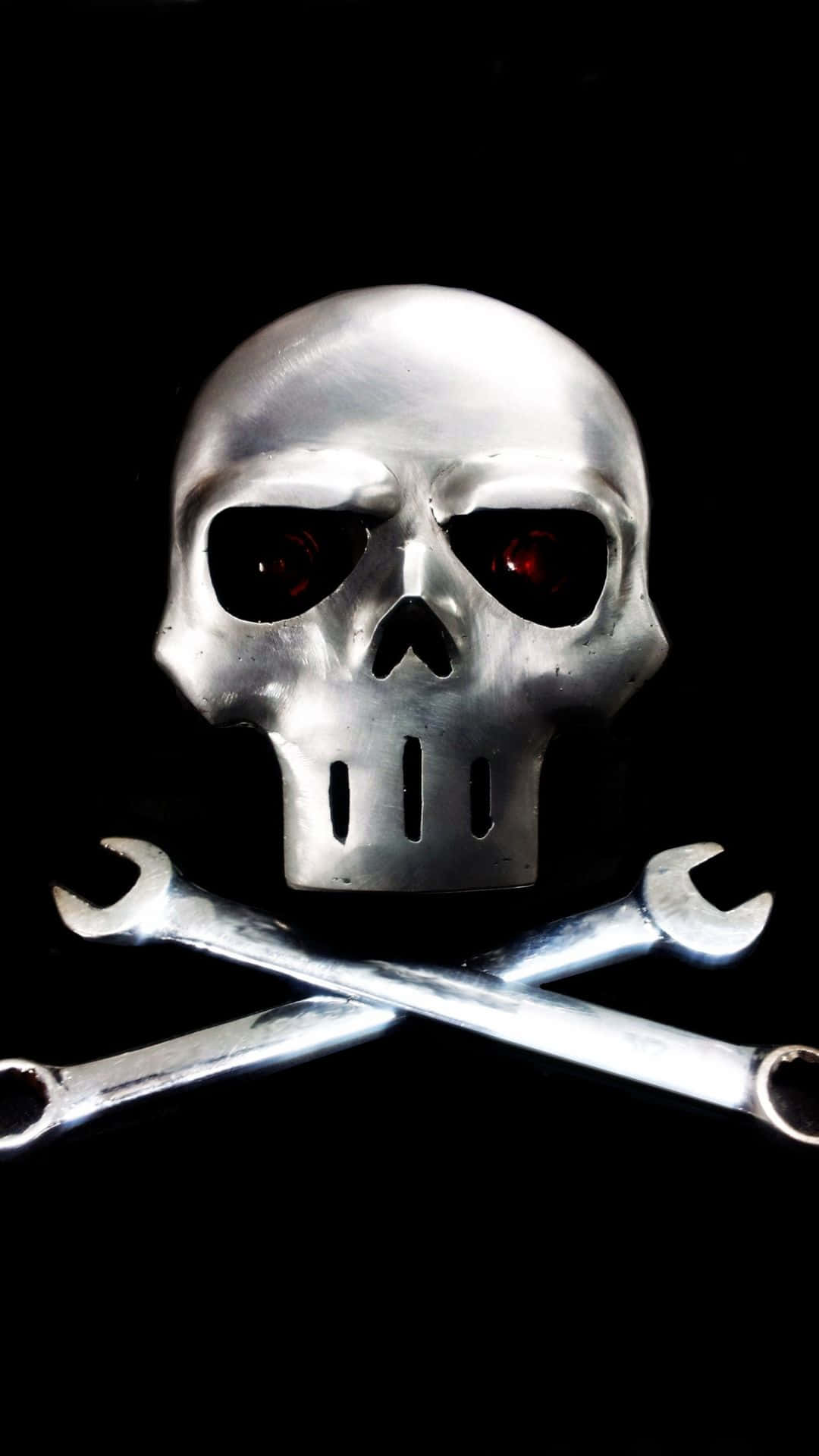 A Skull With Two Wrenches On It Wallpaper