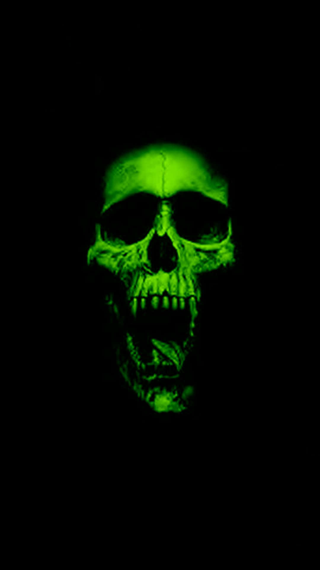 A Green Skull With Teeth On A Black Background Wallpaper