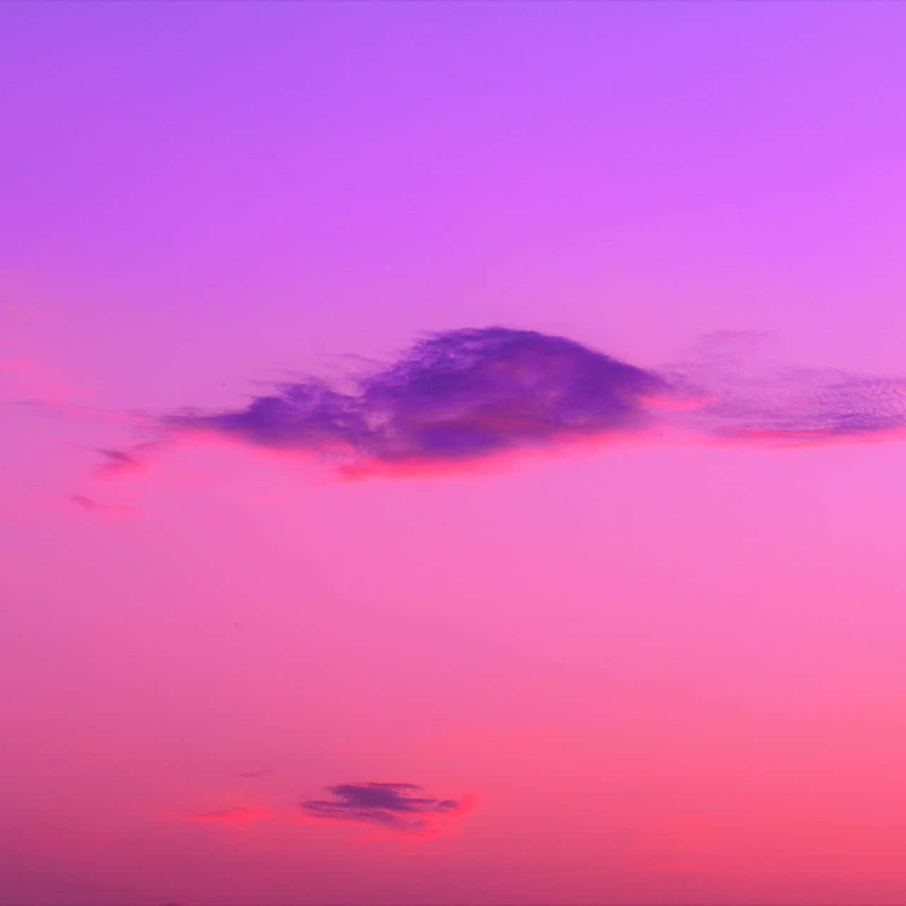 Download A Purple And Pink Sky With A Cloud In The Sky