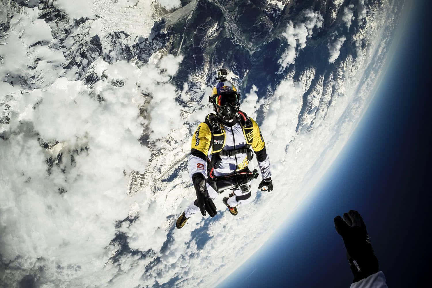 A Man Is Flying In The Air Above The Earth