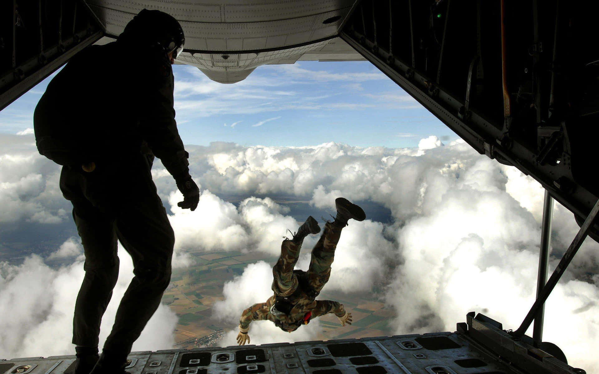 A Man Is Jumping Out Of A Plane