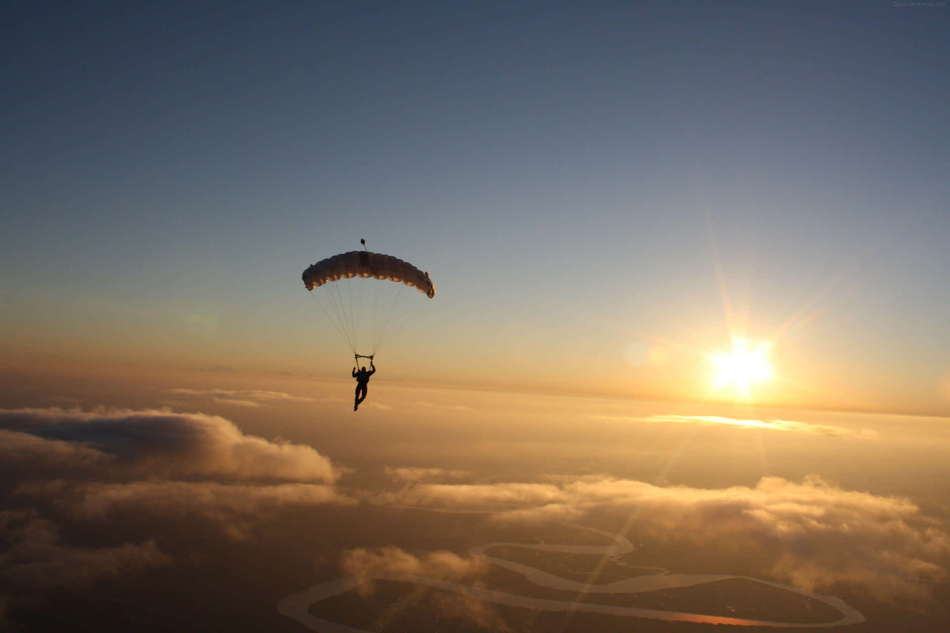 A Person Is Flying A Parachute