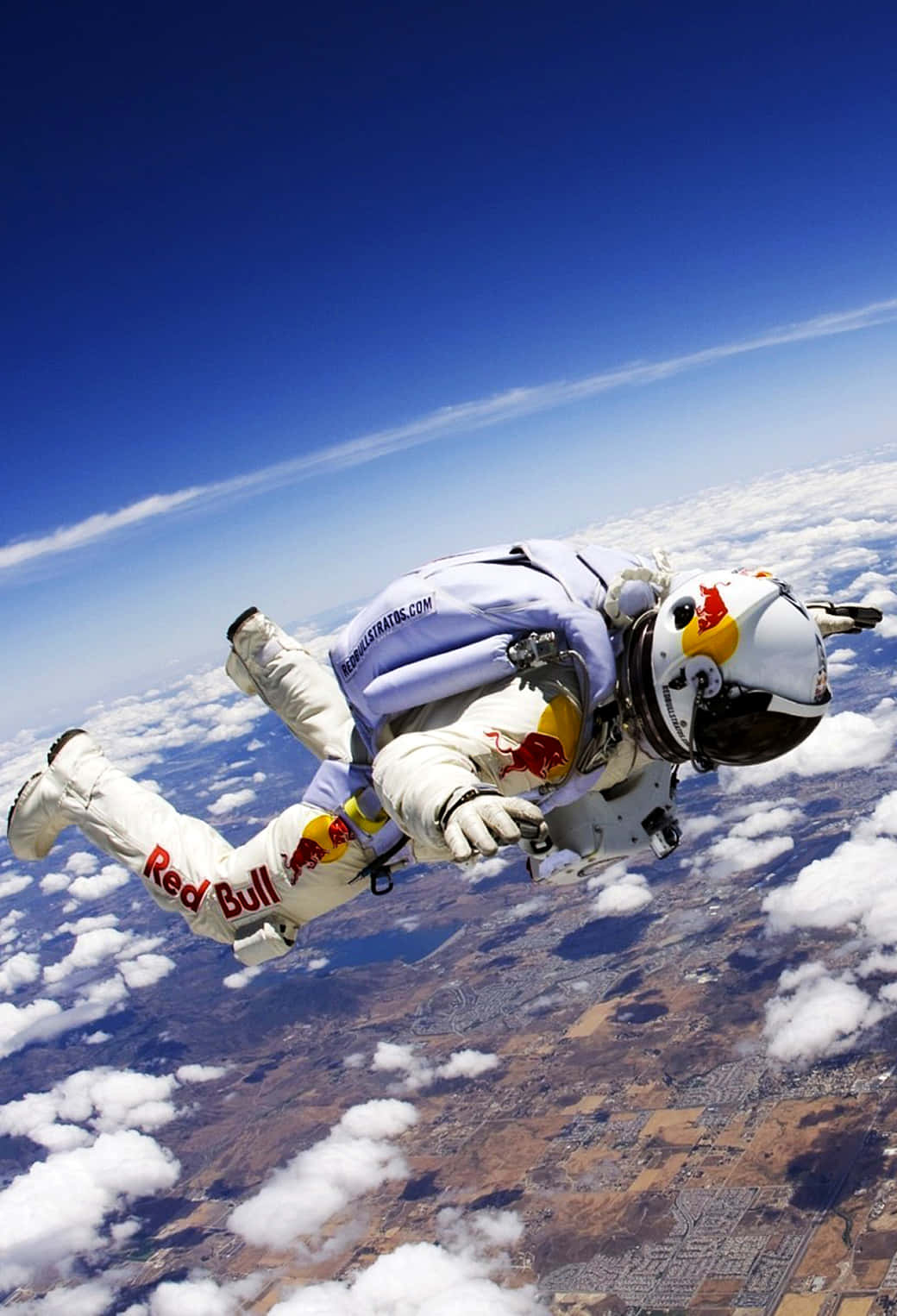 Skydiving Free Falling On Snowy Land Background