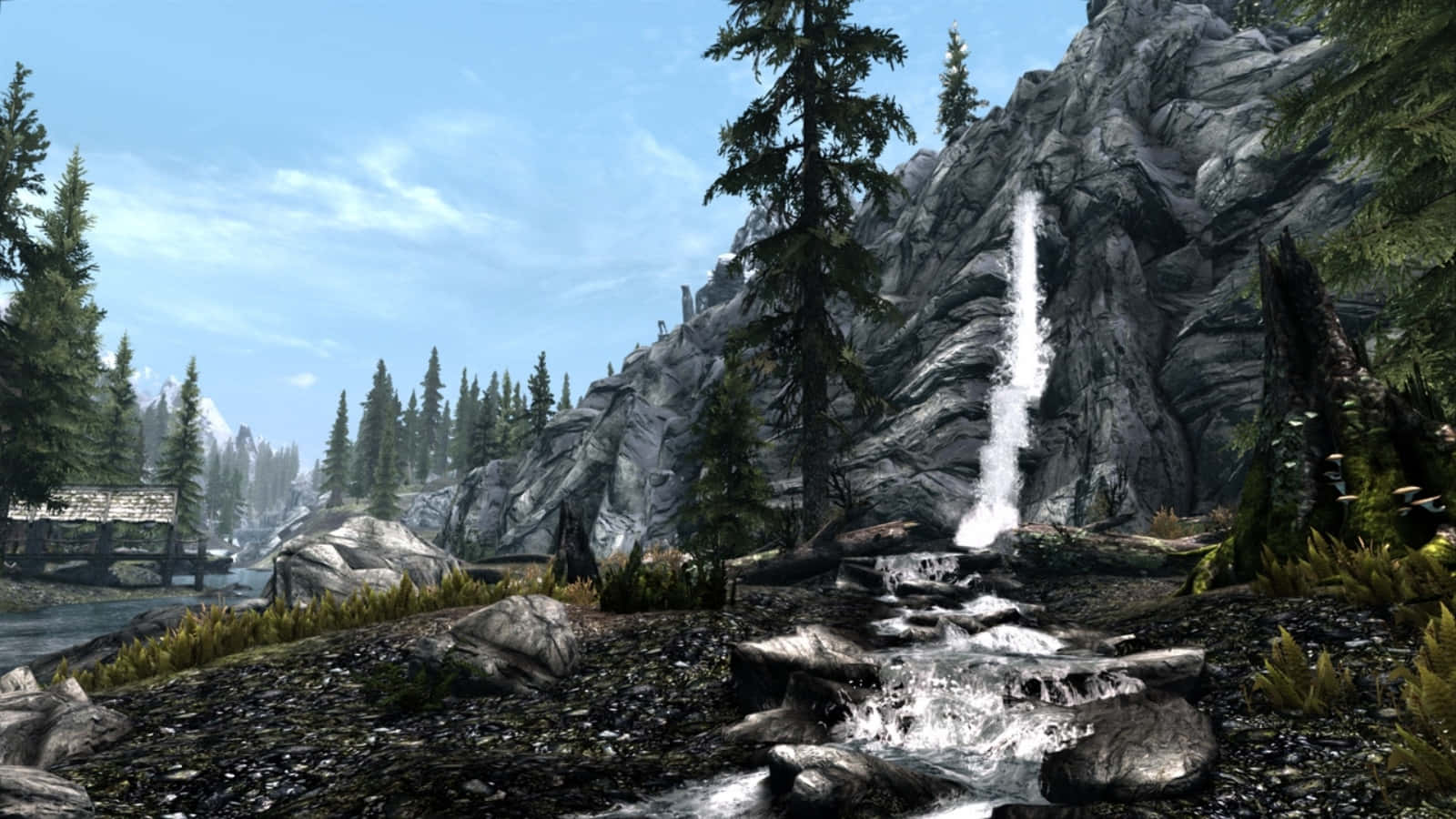 Stunning Skyrim Landscape with Majestic Mountains Wallpaper