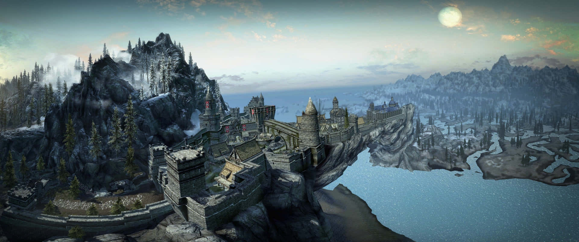 The majestic city of Solitude in Skyrim, towering over a stunning landscape. Wallpaper