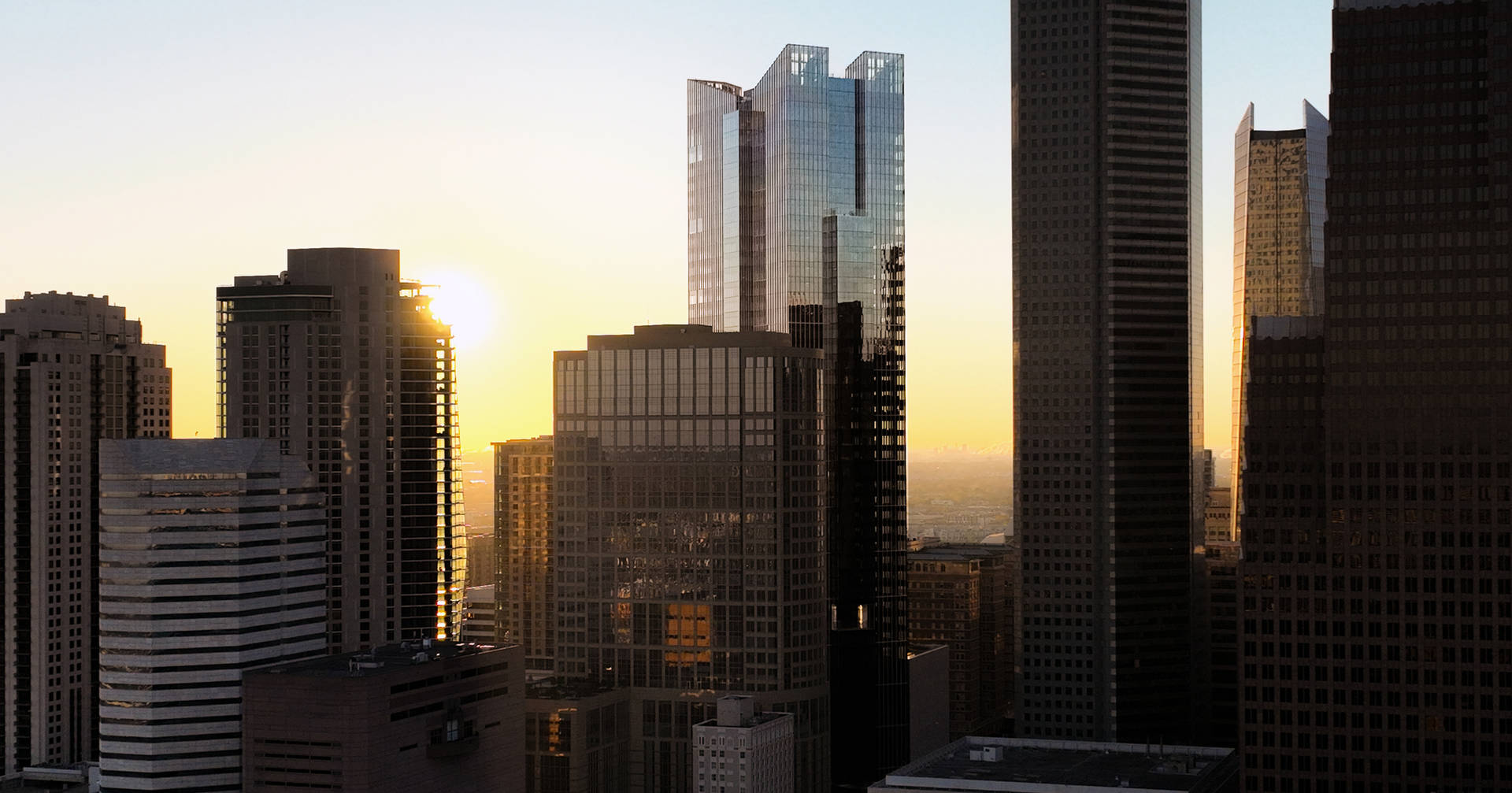 Skyscraper And Sunrise In United States Background