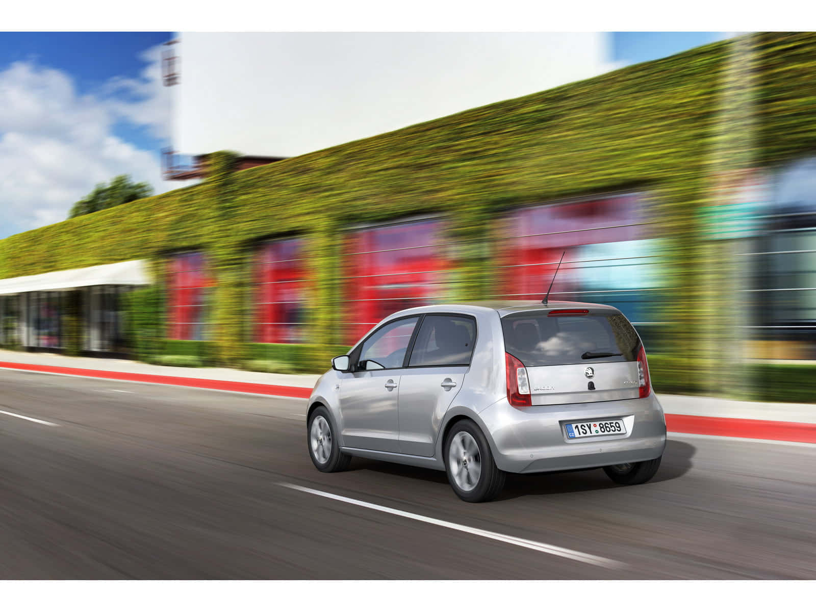 Sleek And Compact Skoda Citigo In Urban Environment Wallpaper