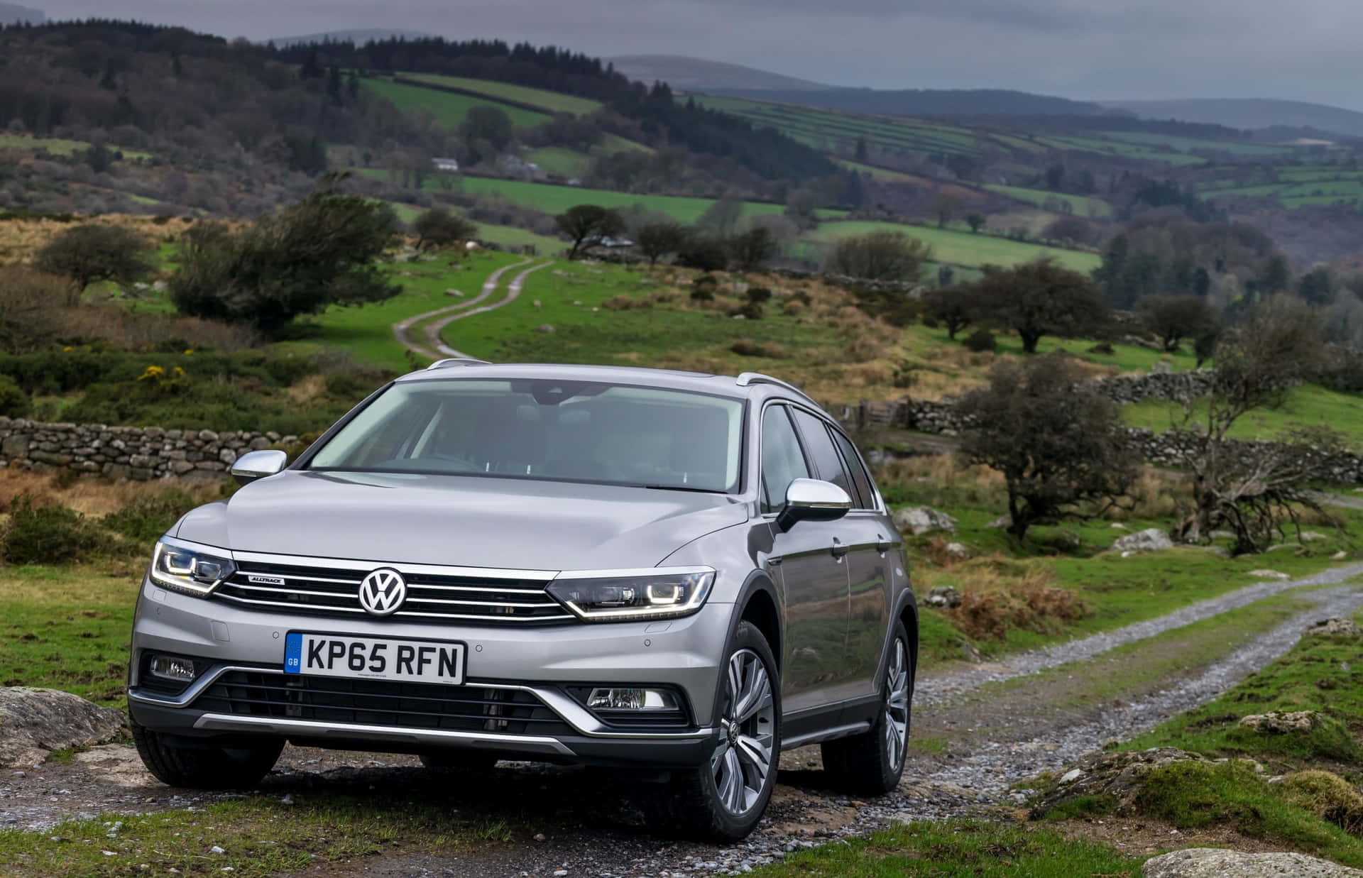 Sleek And Innovative Volkswagen Passat Cruising On The Road Wallpaper