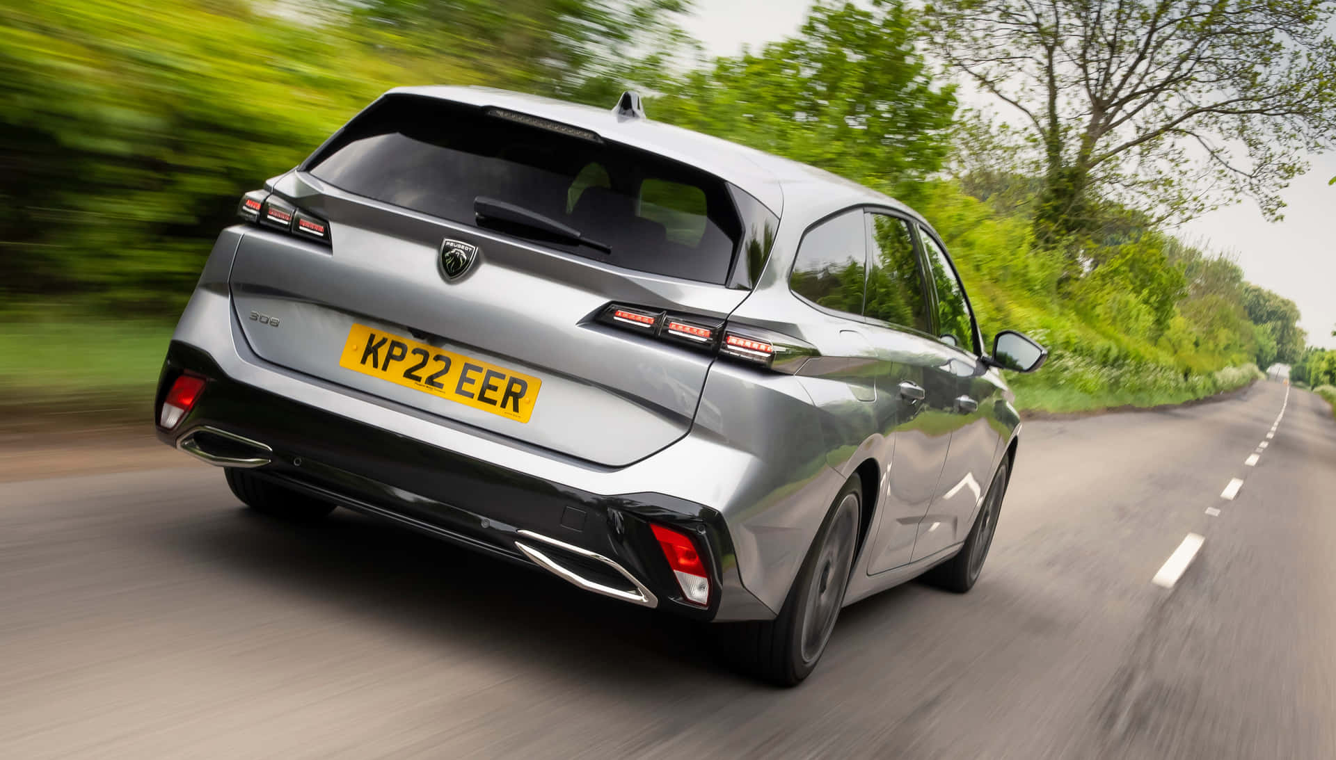 Sleek And Luxurious Peugeot 308 On The Open Road. Wallpaper