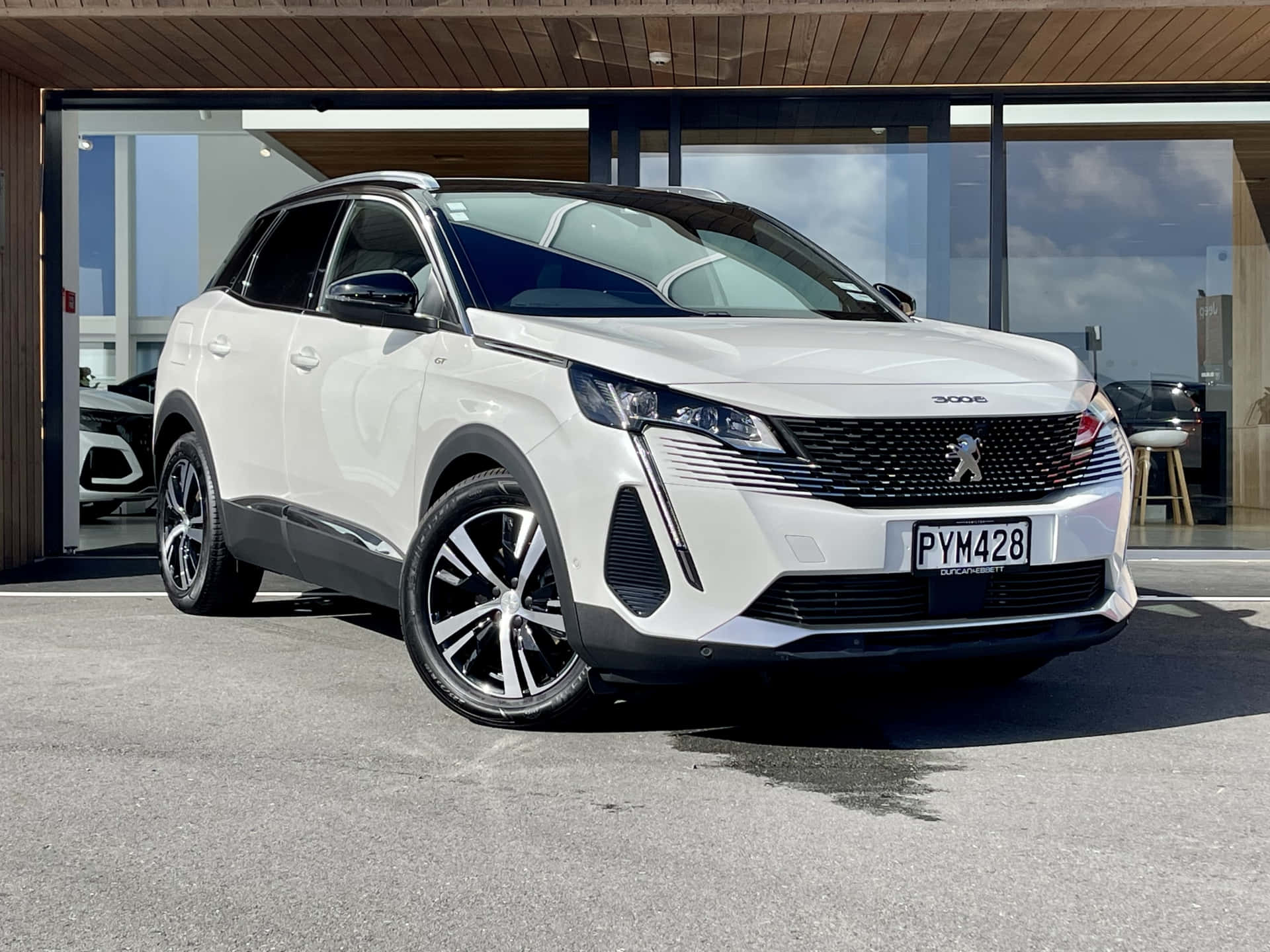 Sleek And Modern Peugeot 3008 Crossover In Motion Wallpaper