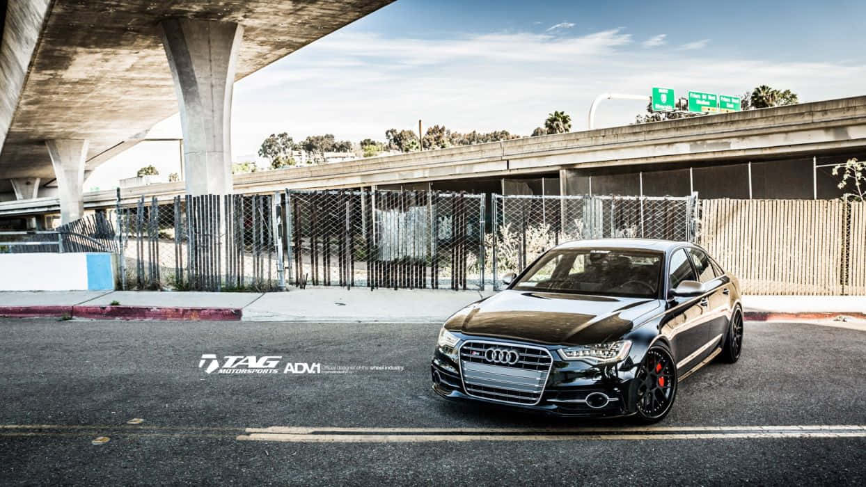 Sleek And Powerful Audi S6 In Action Wallpaper