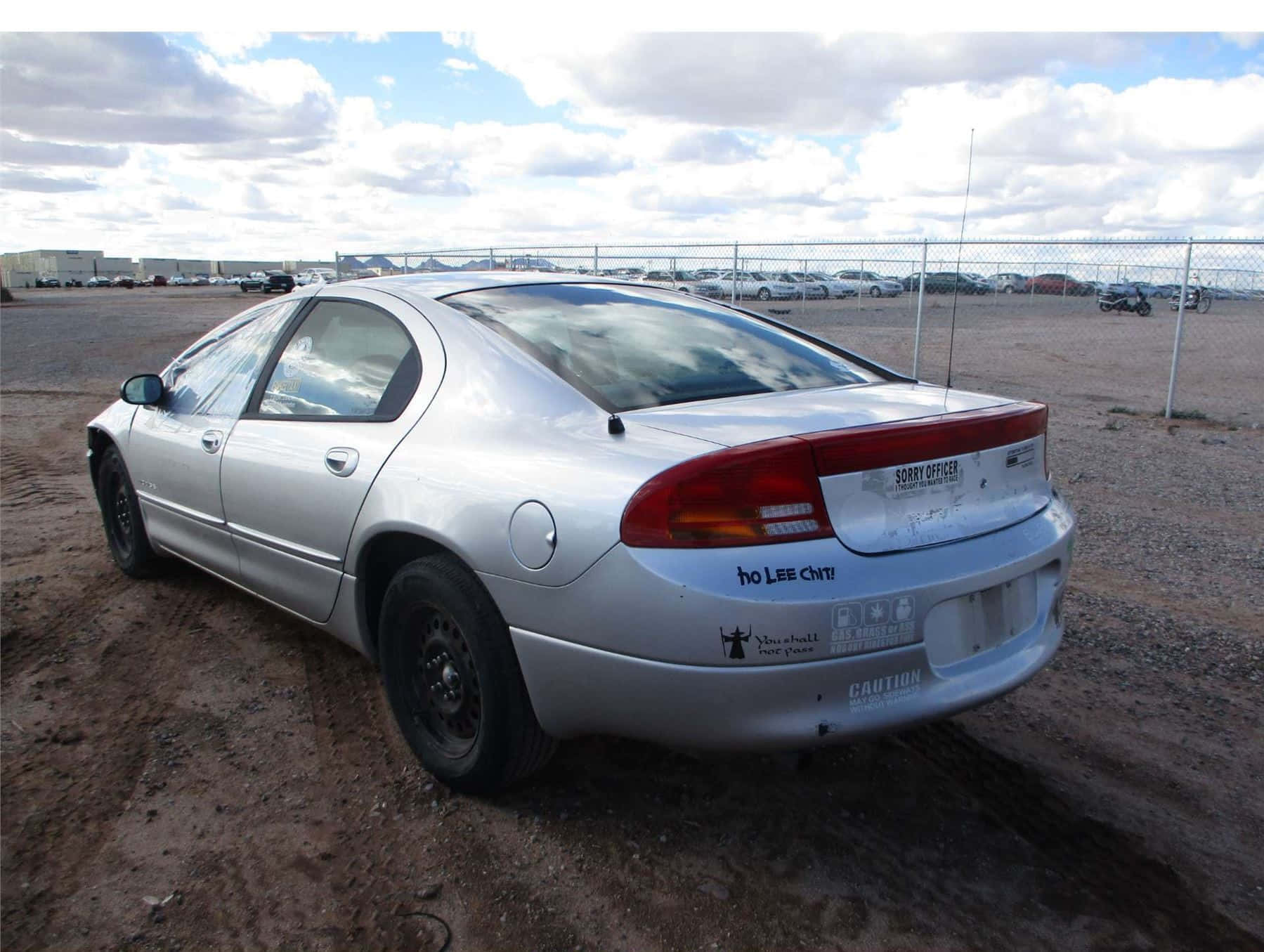 Sleek And Powerful Dodge Intrepid On A Scenic Road Wallpaper