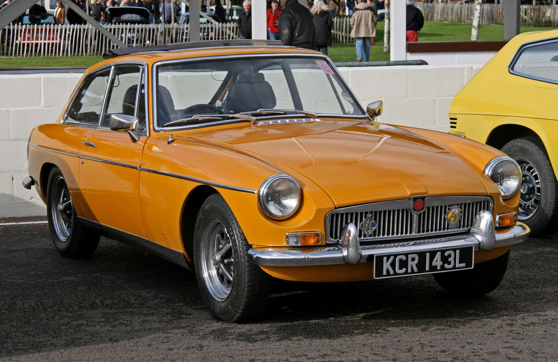 Sleek And Powerful Mg Gt Gliding Down The Highway Wallpaper