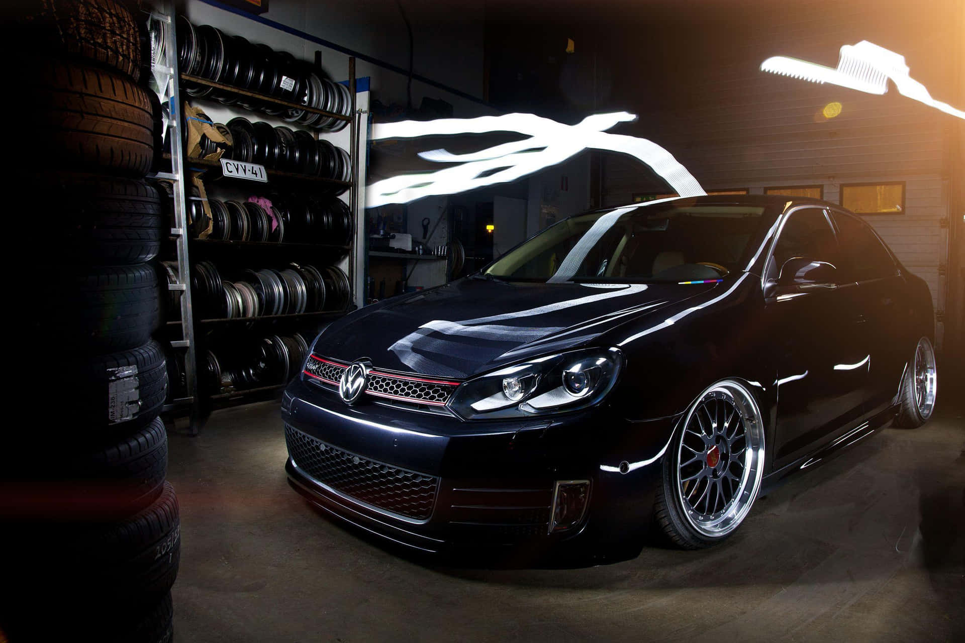 Sleek And Powerful Volkswagen Jetta In Night Cityscape Wallpaper