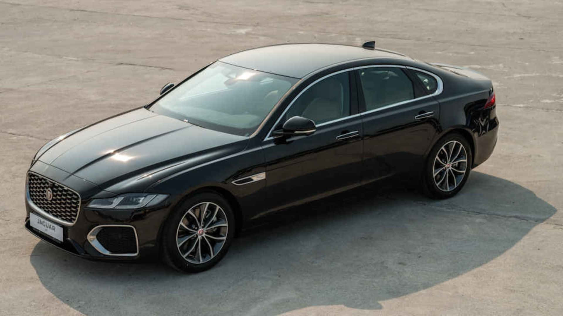 Sleek And Sophisticated Jaguar Xf In Action Wallpaper