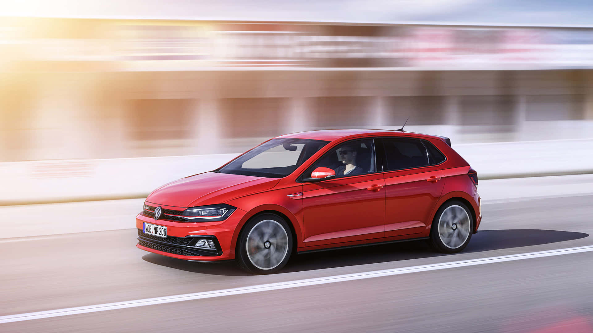 Sleek And Sophisticated Volkswagen Polo On The Open Road Wallpaper