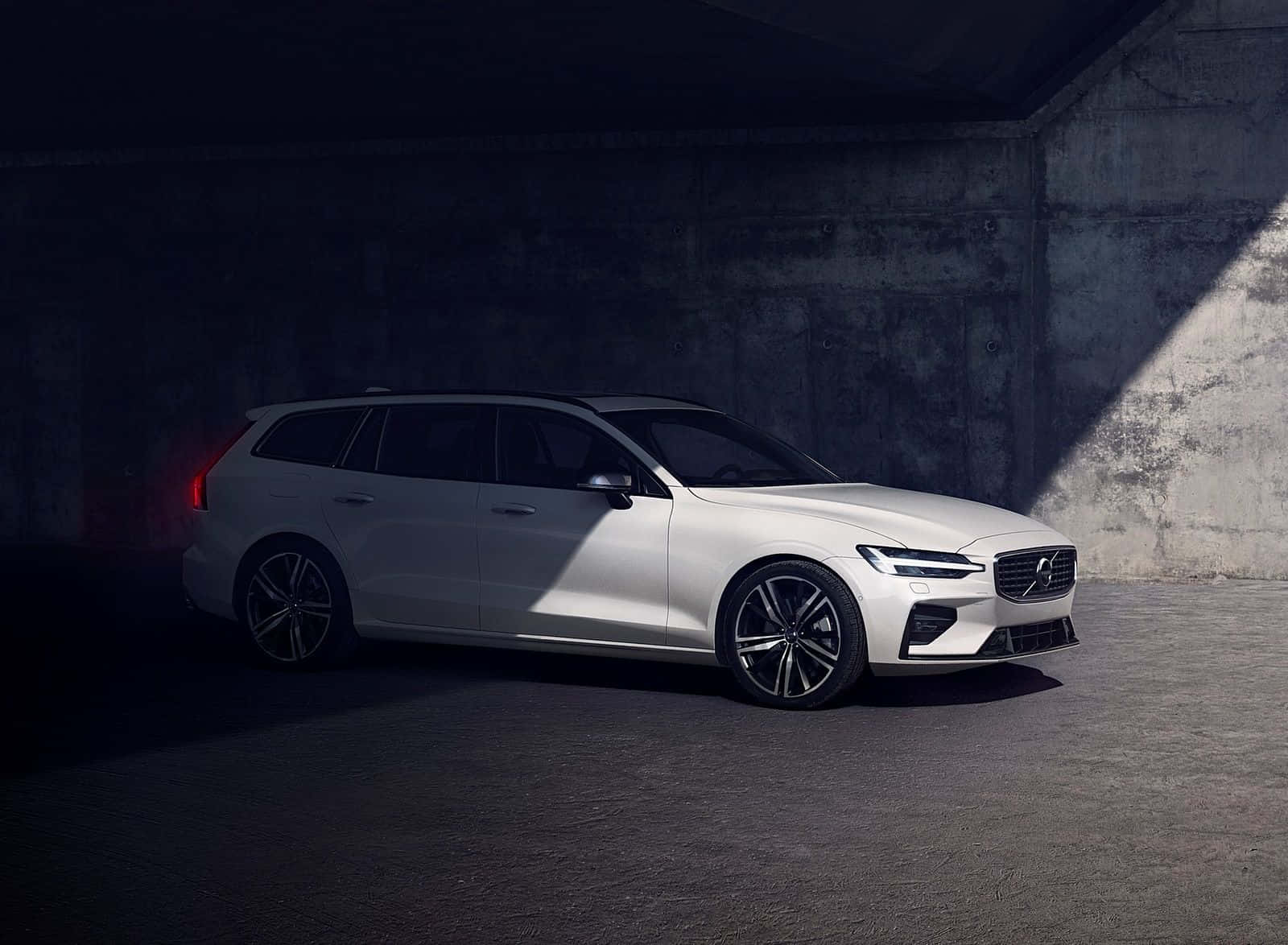 Sleek And Sophisticated Volvo V60 On The Road Wallpaper