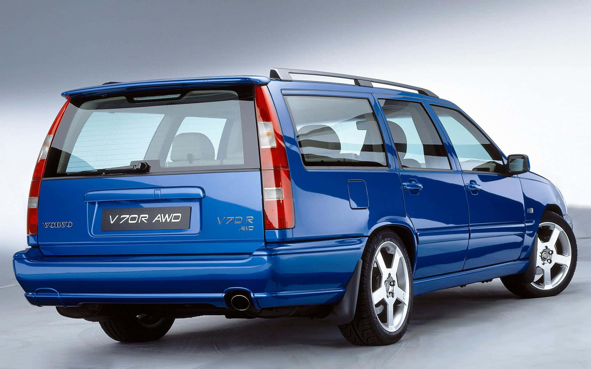 Sleek And Sophisticated Volvo V70 In Motion Wallpaper