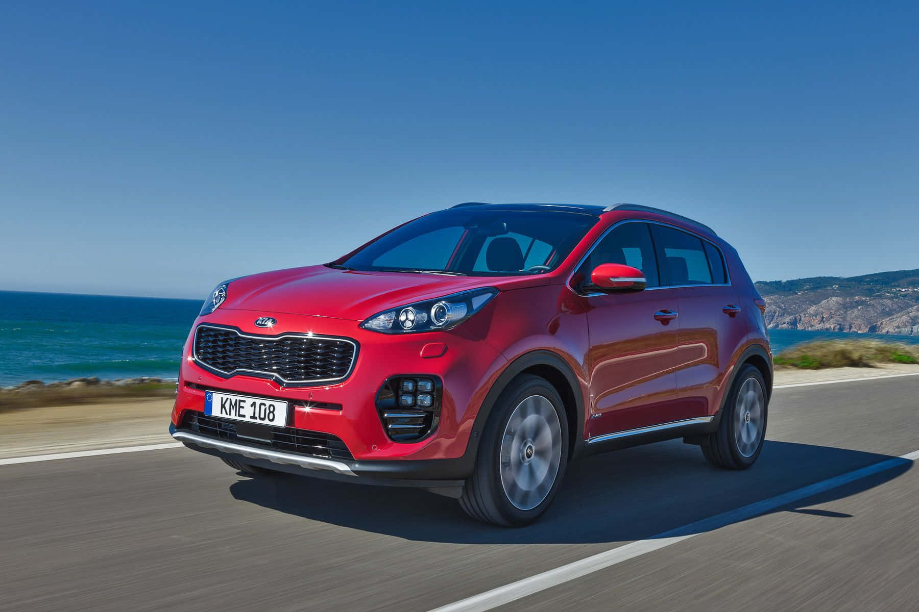 Sleek And Sporty Kia Sportage In Urban Setting Wallpaper