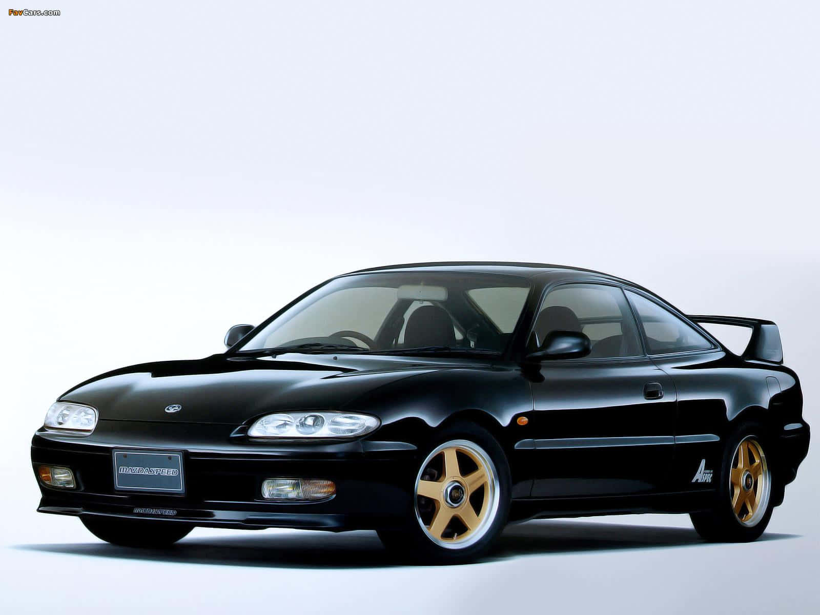 Sleek And Sporty: Mazda Mx-6 In Action Wallpaper