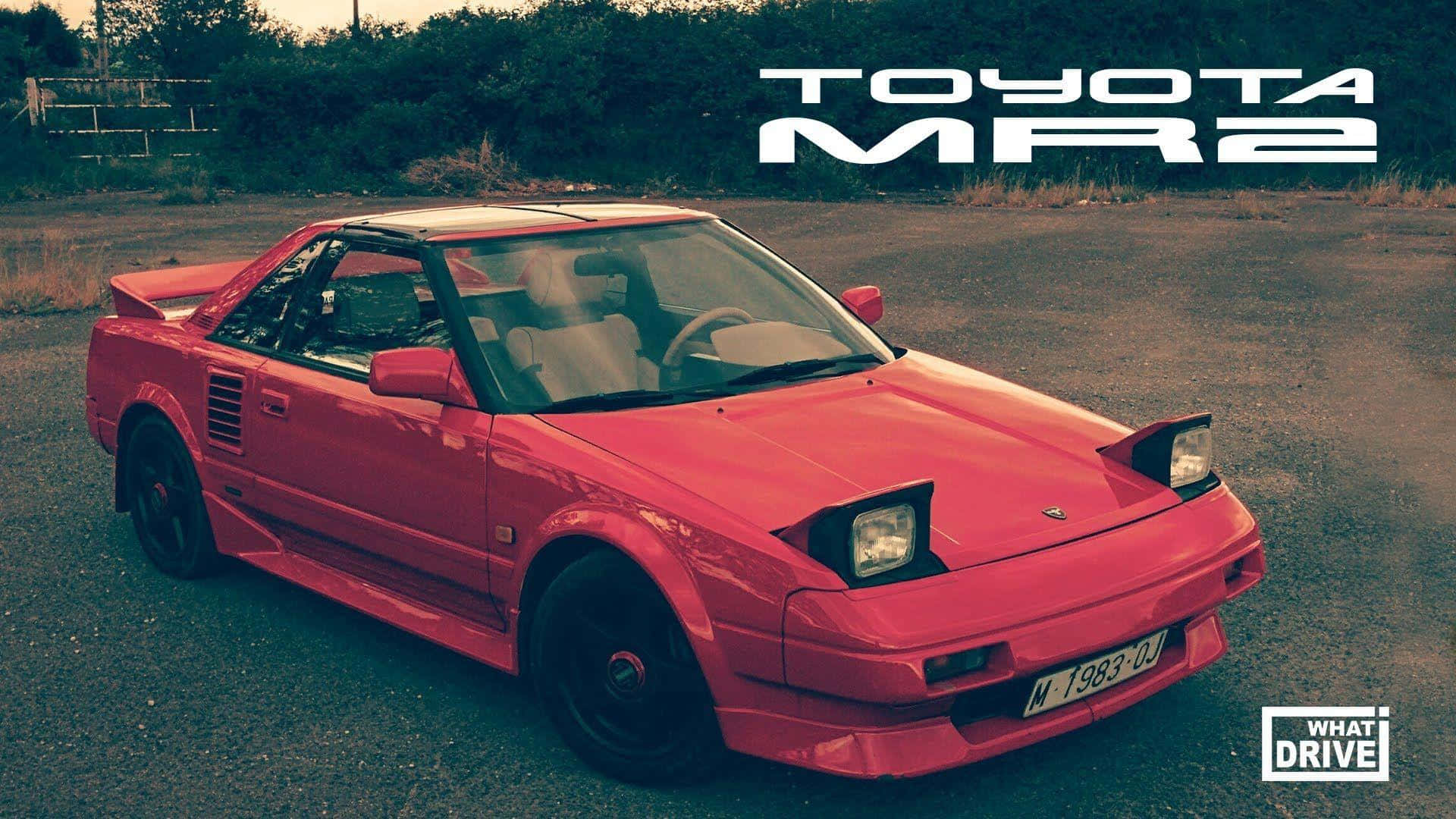 Sleek And Sporty Red Toyota Mr2 On The Open Road Wallpaper