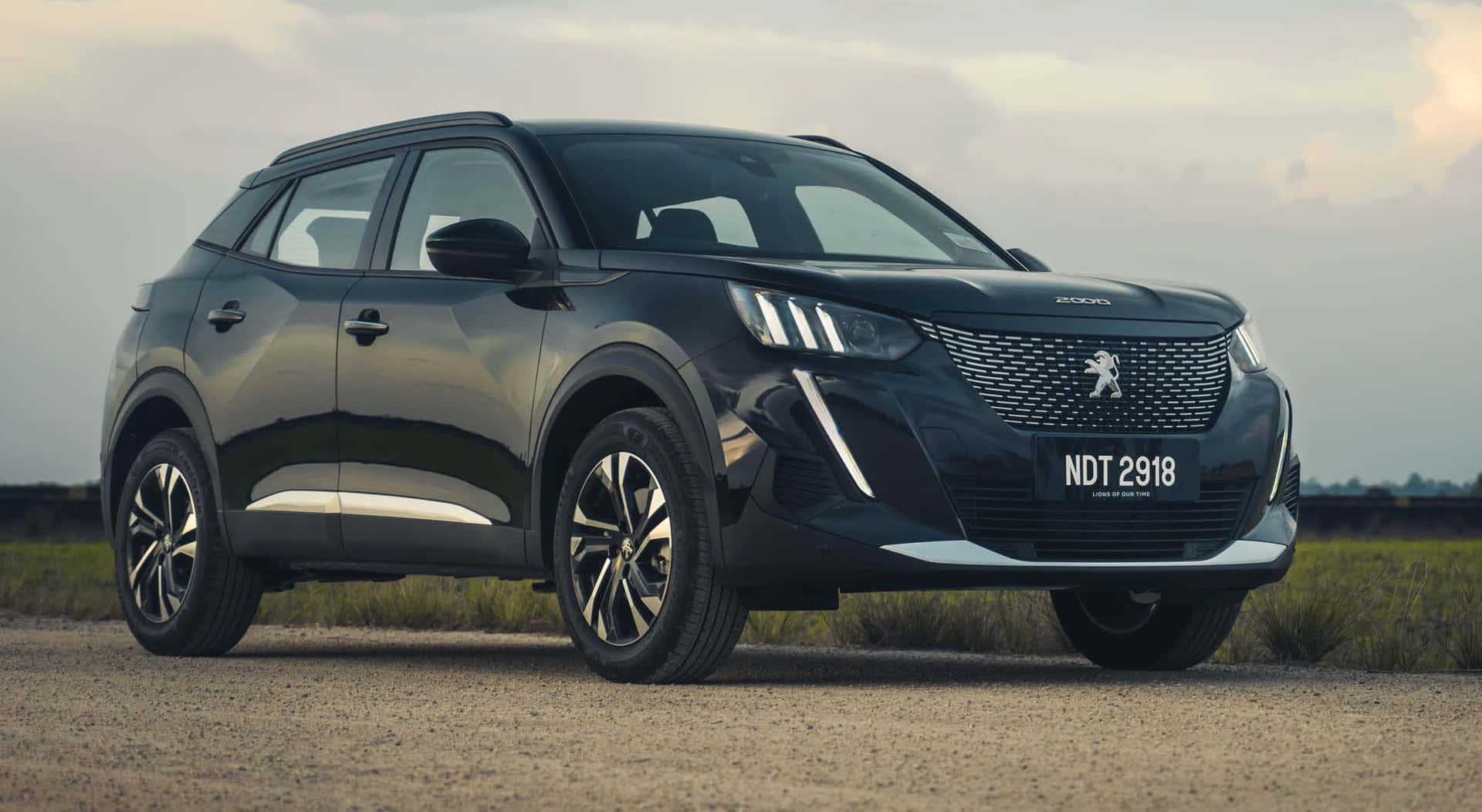 Sleek And Stylish Peugeot 2008 On The Road Wallpaper