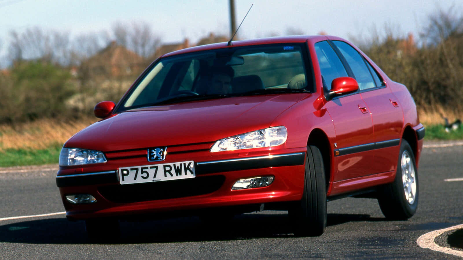 Sleek And Stylish Peugeot 406 In Vibrant Surroundings Wallpaper