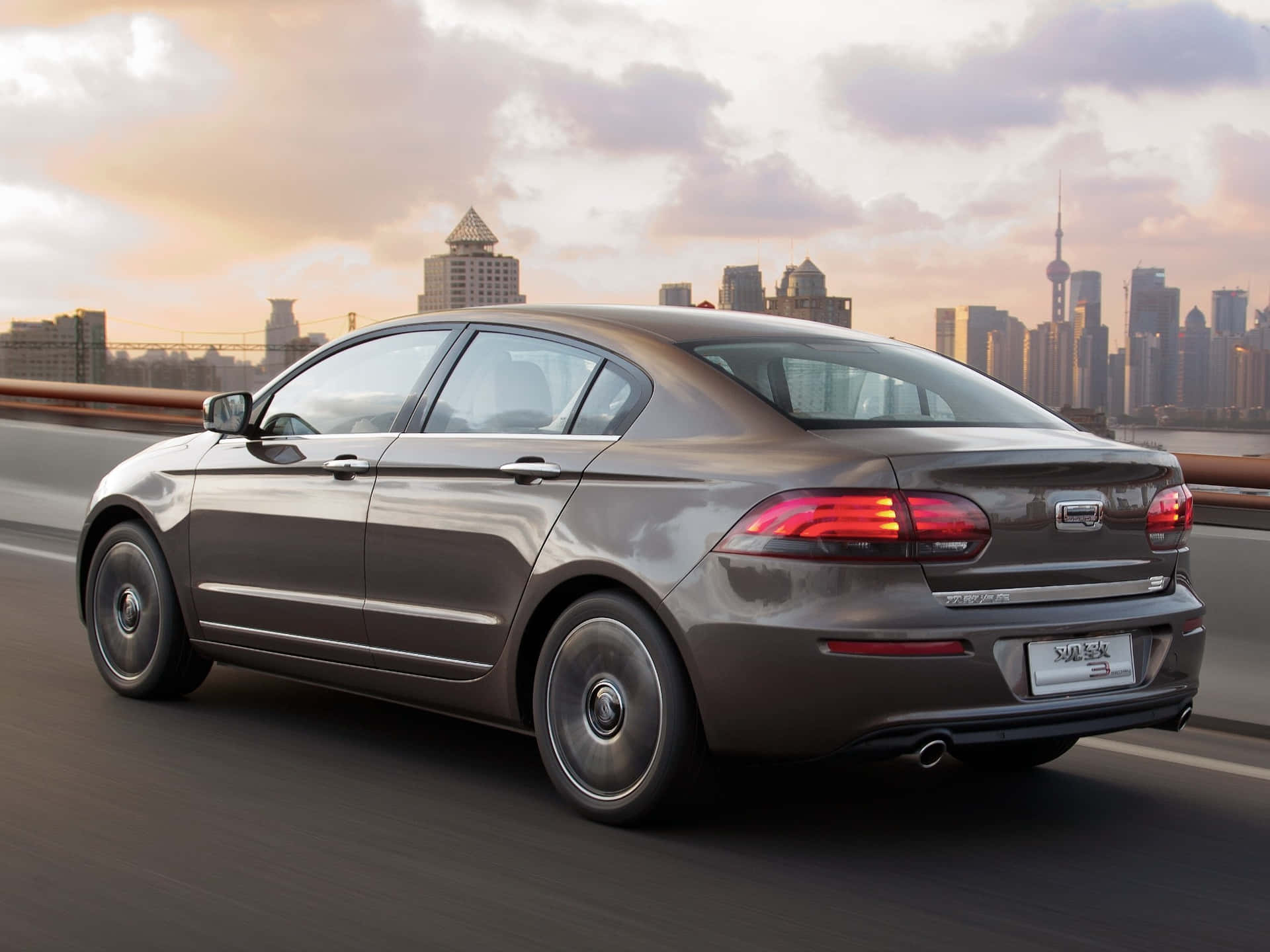 Sleek And Stylish Qoros 3 Sedan On The Highway Wallpaper