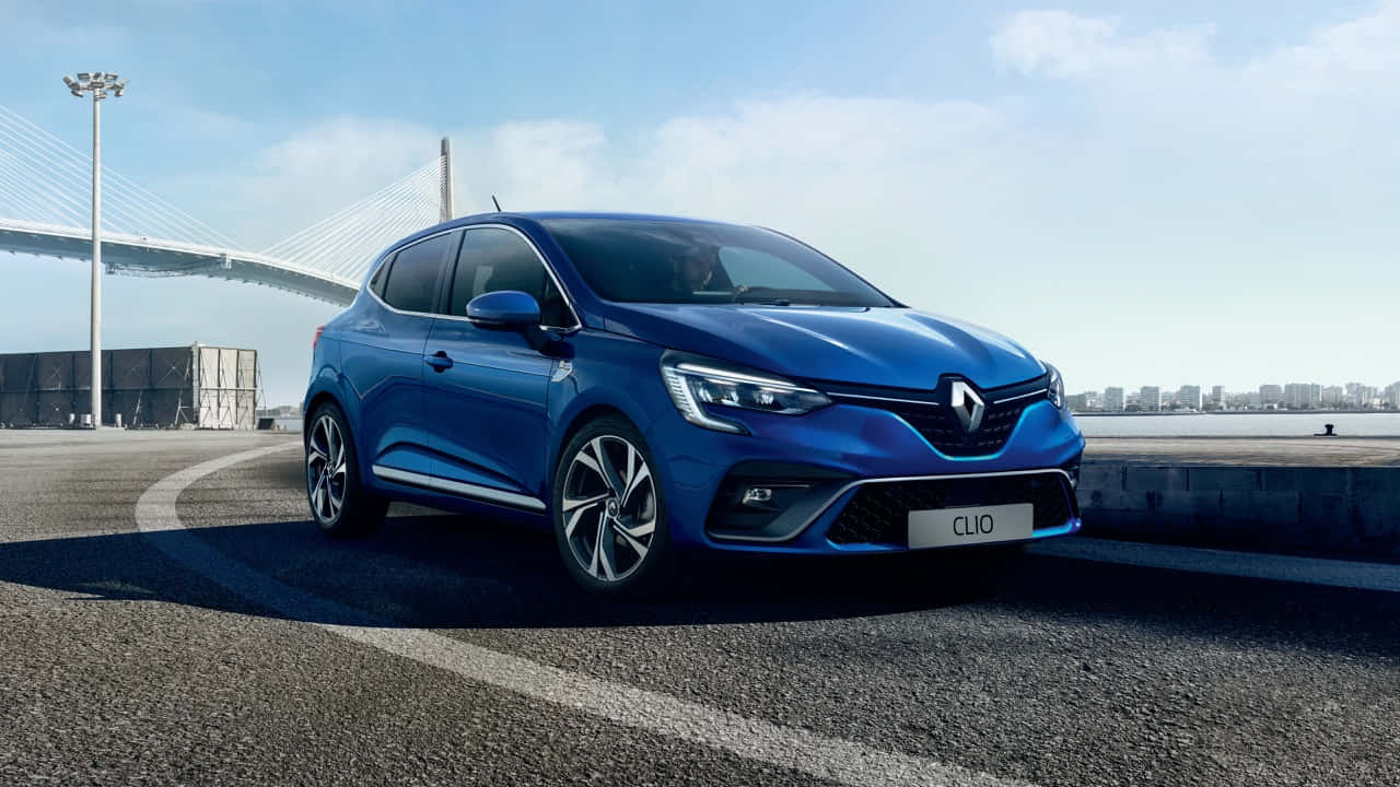 Sleek And Stylish Renault Clio On Open Road Wallpaper