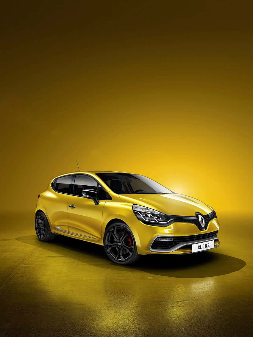 Sleek And Stylish Renault Clio On The Move Wallpaper