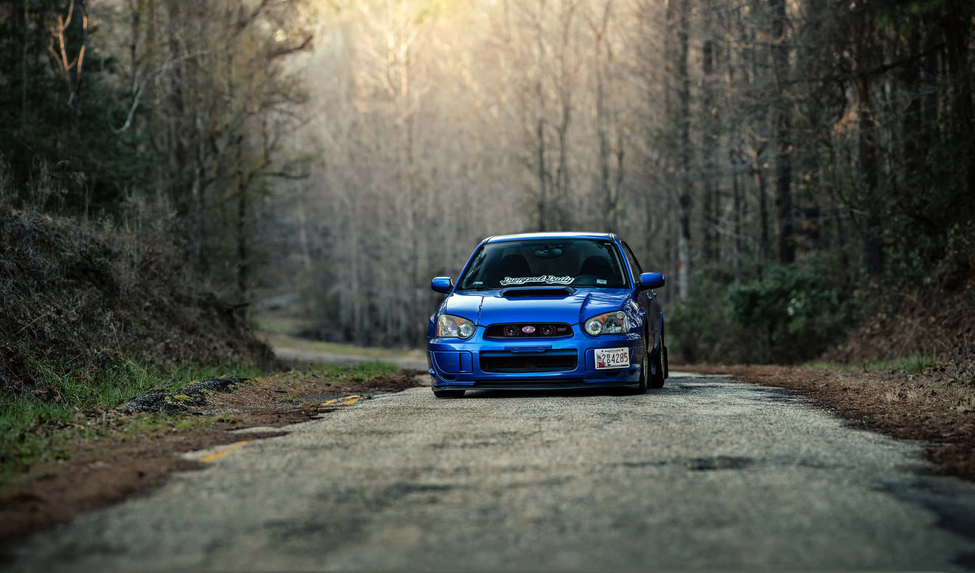 Sleek And Stylish Subaru Impreza In Action Wallpaper