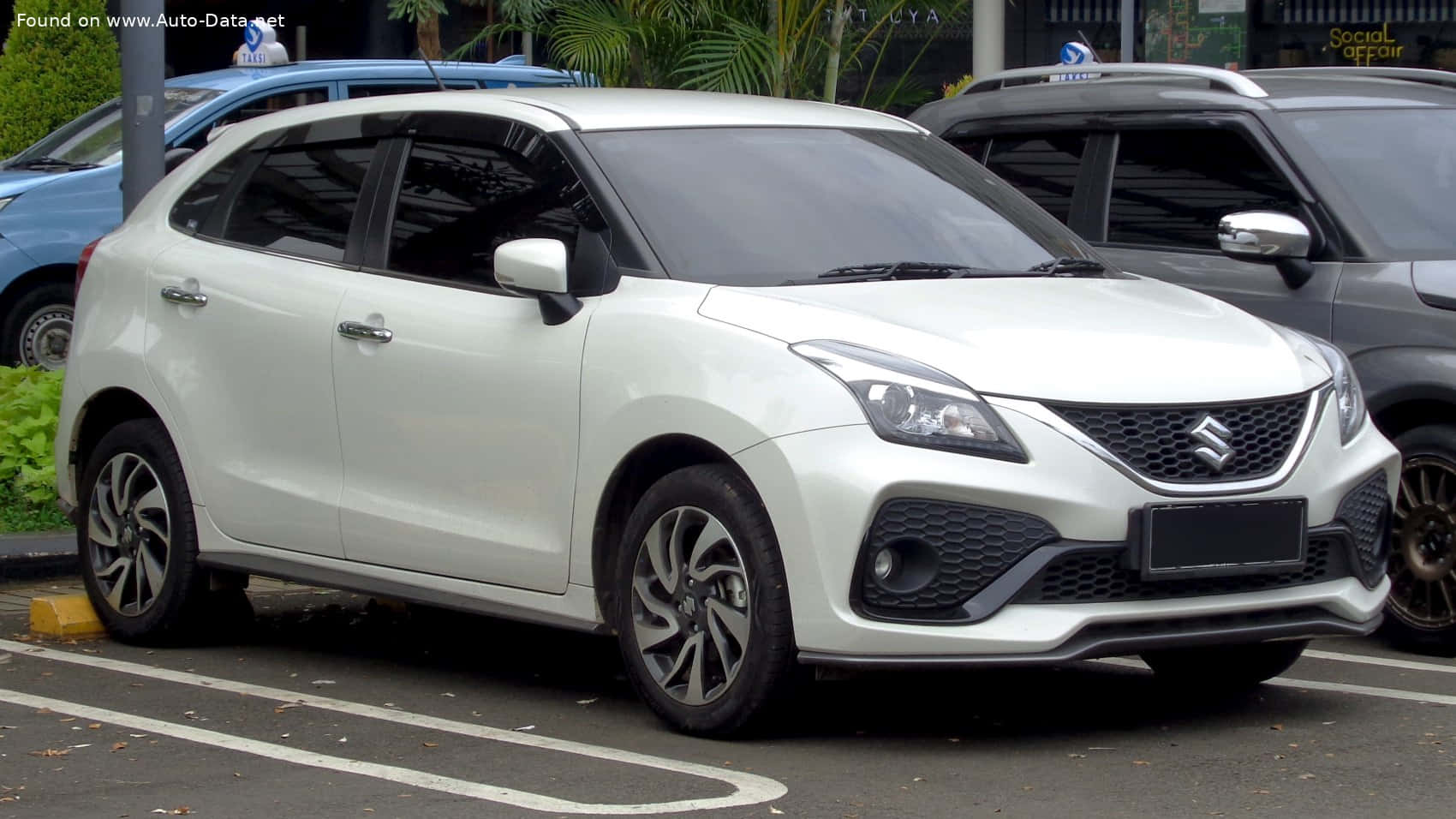 Sleek And Stylish Suzuki Baleno Gliding On The Highway. Wallpaper