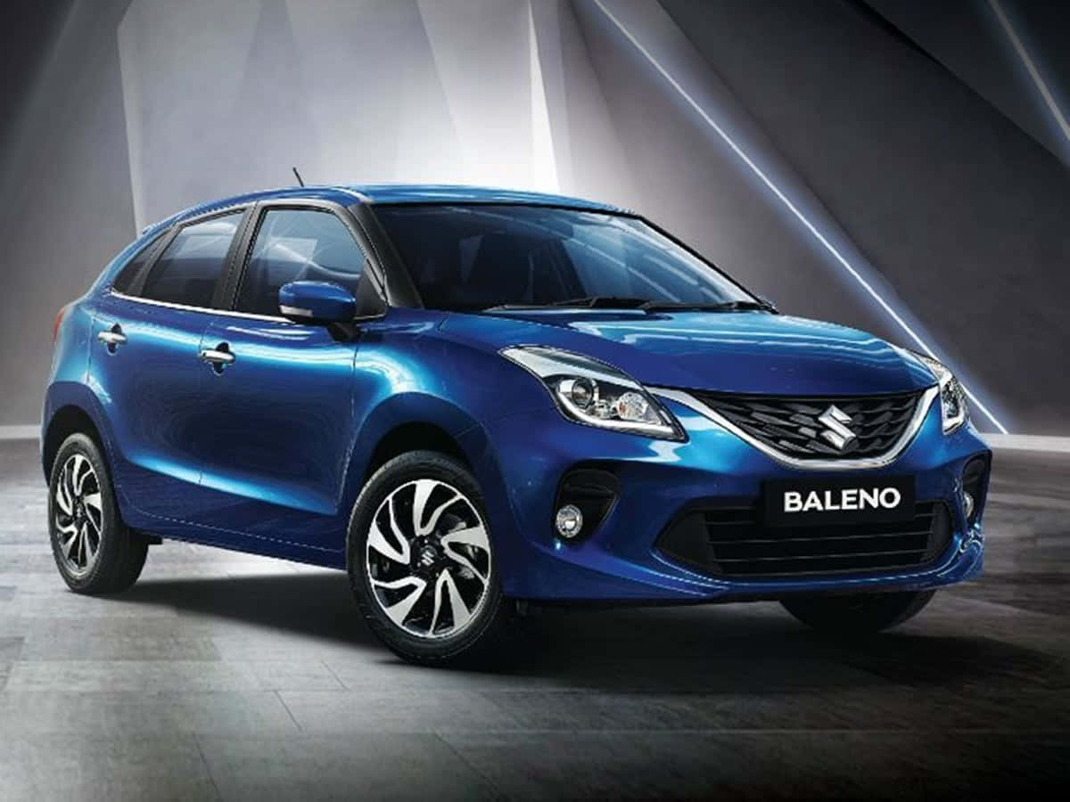 Sleek And Stylish Suzuki Baleno In Motion Wallpaper