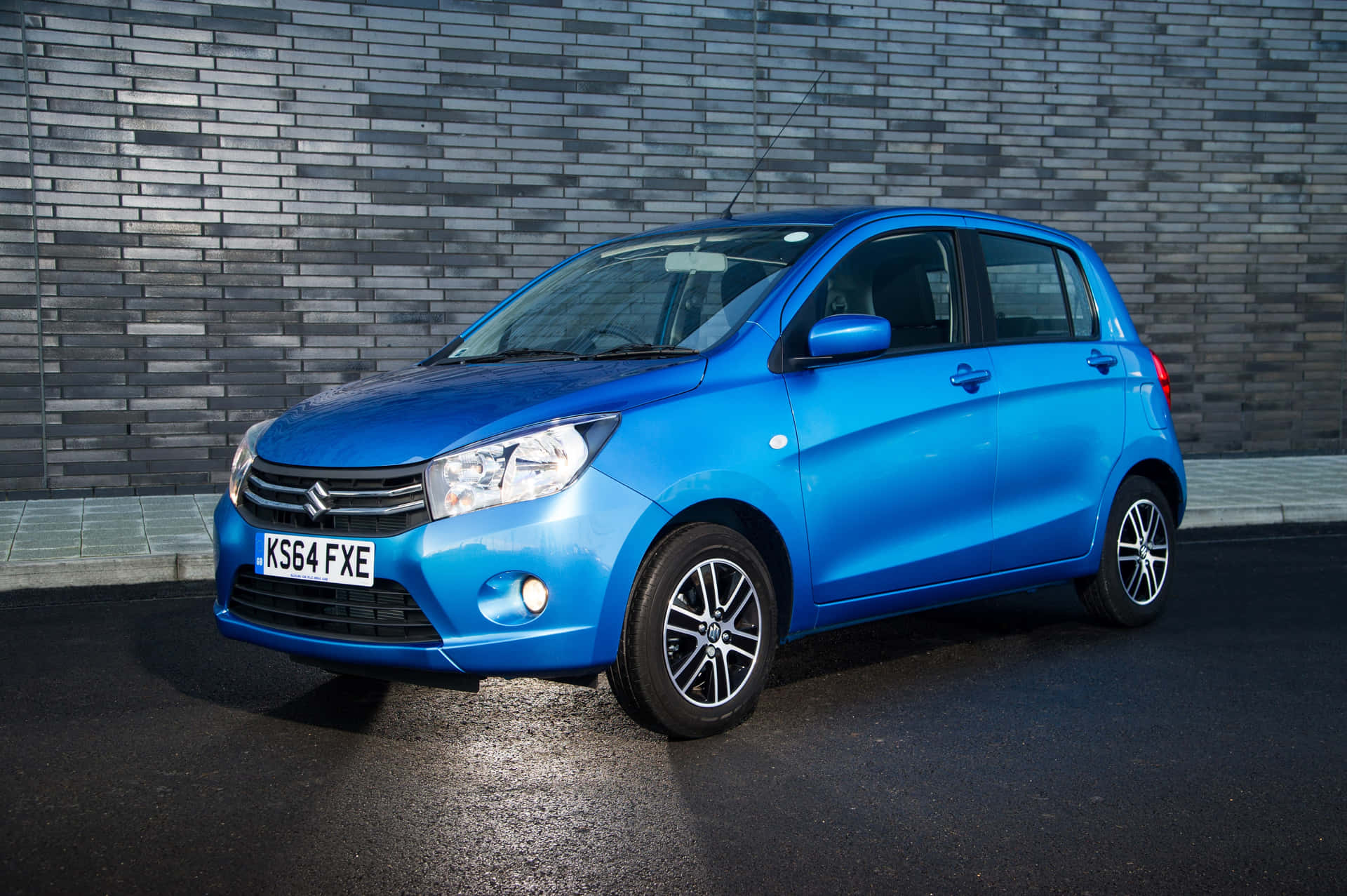 Sleek And Stylish Suzuki Celerio On The Road Wallpaper