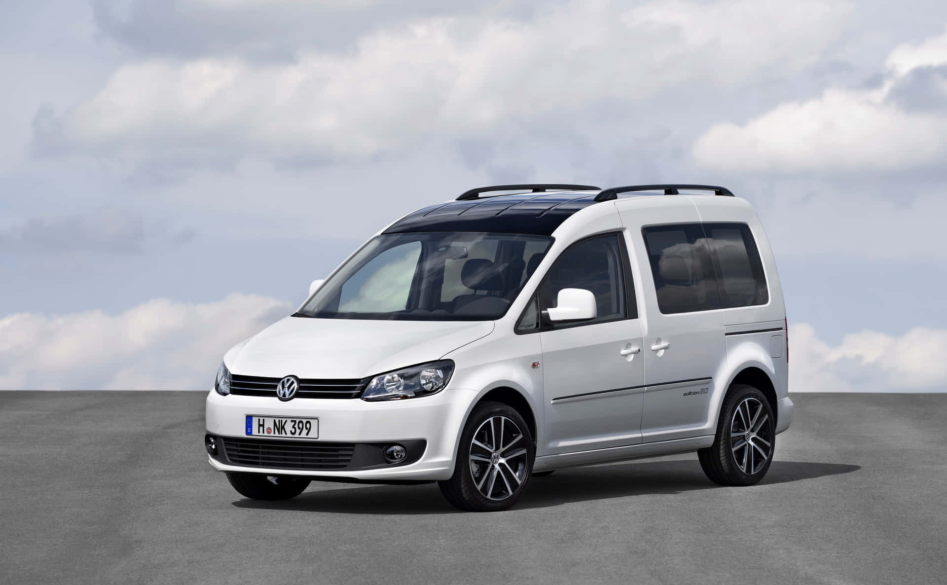Sleek And Stylish - The Volkswagen Caddy On City Streets Wallpaper